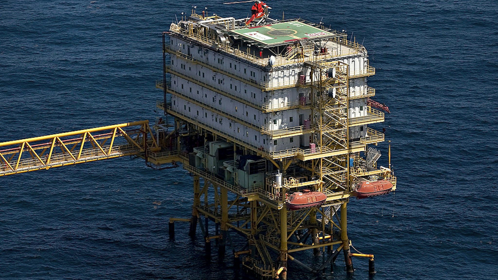 A helicopter lands on a habitation platform linked to a Petroleos Mexicanos offshore rig producing oil from the Ku-Maloob-Zaap field in the Gulf of Mexico 65 miles northeast of Ciudad del Carmen, Mexico, on Thursday, Oct. 7, 2010.