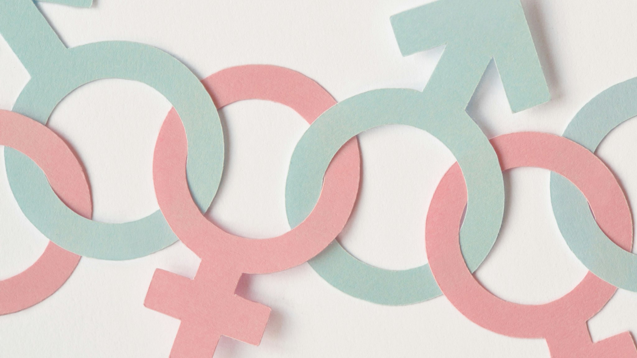 Close-Up Of Gender Symbols On White Background - stock photo
