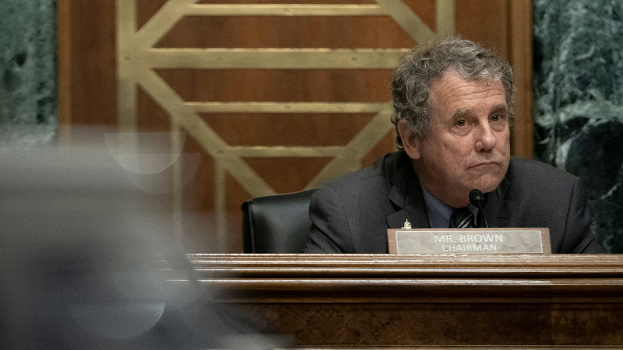 Senator Sherrod Brown, a Democrat from Ohio and chairman of the Senate Banking, Housing, and Urban Affairs Committee, listens during a confirmation hearing in Washington, D.C., U.S., on Tuesday, June 22, 2021
