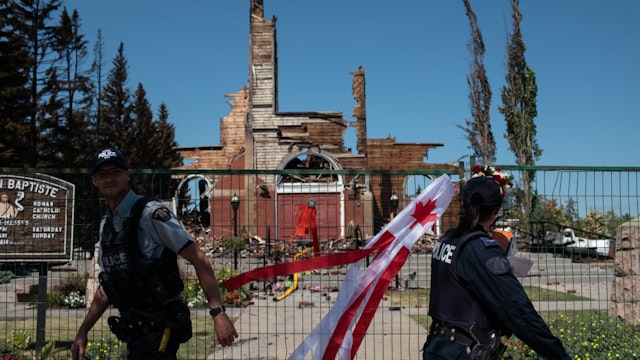 ALBERTA, CANADA - JULY 01: Firefighters inspect the damage at the Roman Catholic St. Jean Baptiste church destroyed by fire in Morinville, Alberta on Thursday, July 1, 2021.