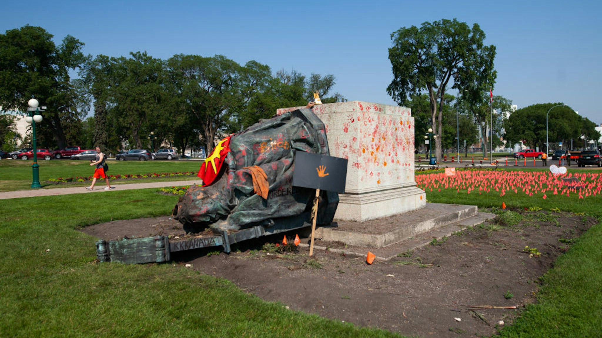 WINNIPEG, CANADA - JULY 02: A toppled statue of Queen Victoria on the grounds of the Manitoba Legislature on July 2, 2021 in Winnipeg, Manitoba, Canada. The statue was pulled down by indigenous protestors following a march to honour survivors and victims of Canadaâs residential school system.