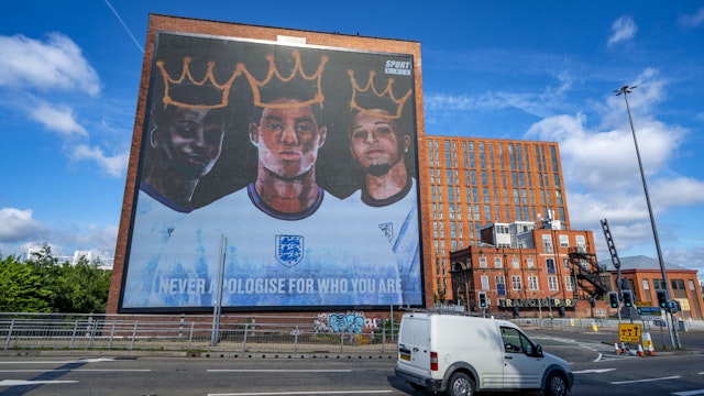 A digital mural of England players Marcus Rashford, Jadon Sancho and Bukayo Saka in Manchester. The mural appeared on Tuesday after the England football team lost the UEFA Euro 2021 final. Picture date: Wednesday July 14, 2021. (Photo by Peter Byrne/PA Images via Getty Images)