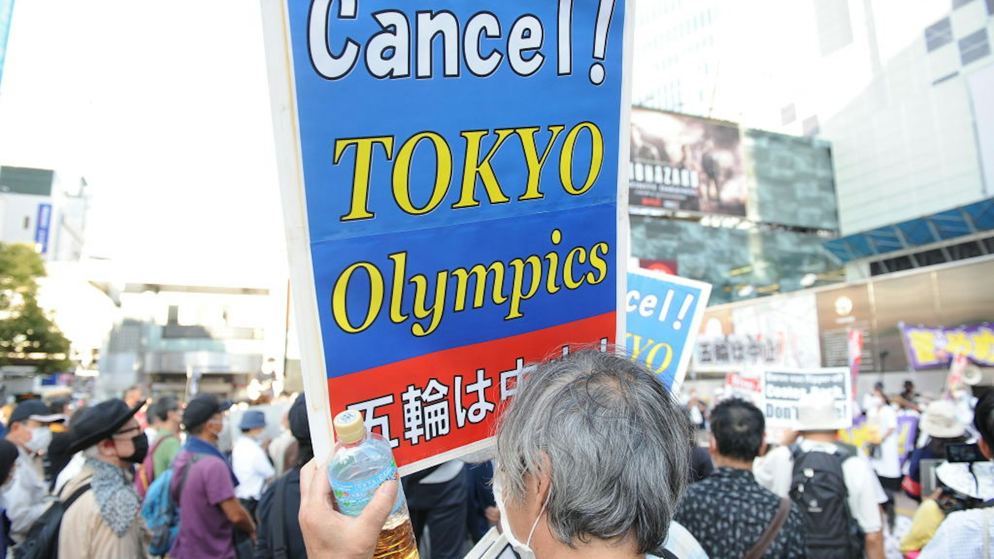 TOKYO, JAPAN - JULY 23 : People protest against the Opening ceremony of 2020 Tokyo Summer Olympic Games on July 23, 2020 in Tokyo, Japan, as they ask for the cancel of the Games a few hours ahead of the Opening ceremony of the Tokyo Games. (Photo by David Mareuil/Anadolu Agency via Getty Images)