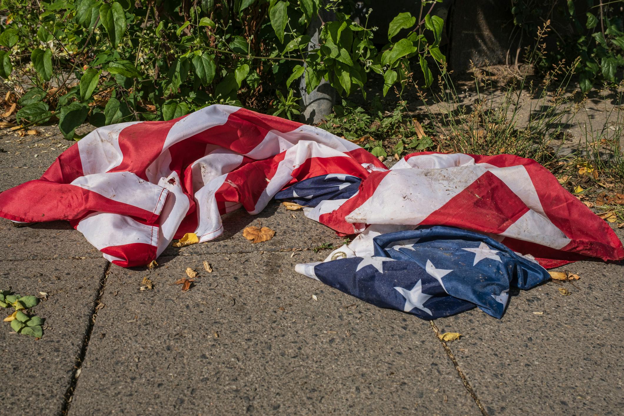 Viral Door Cam Video Appears To Show Mom Watching Child Desecrate American Flag