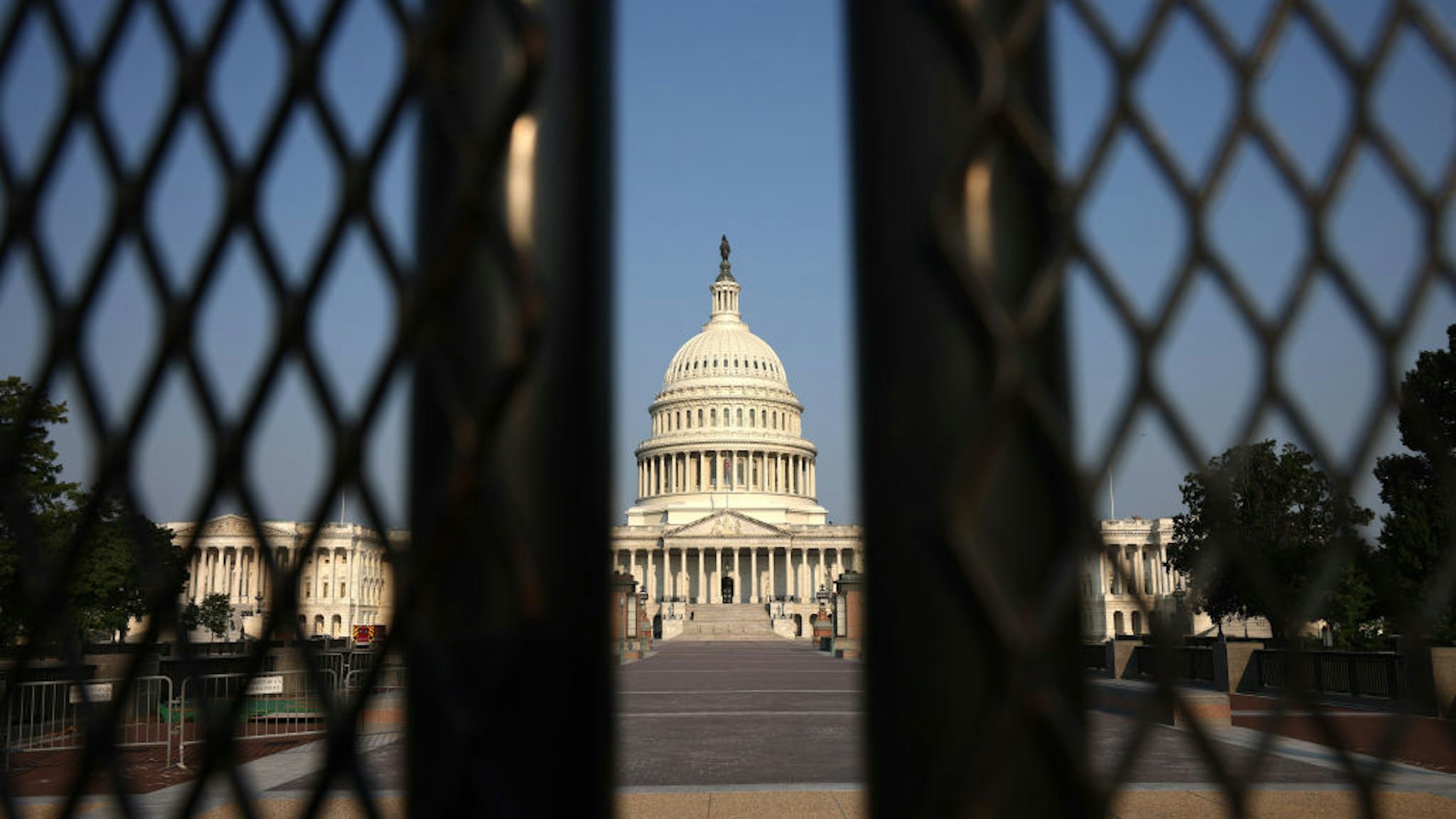 The U.S. Capitol is seen behind security fencing on July 06, 2021 in Washington, DC.