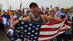 Rally In Miami Held In Support Of Cuban Protestors MIAMI, FLORIDA - JULY 13: Protesters shut down part of the Palmetto Expressway as they show their support for the people in Cuba that have taken to the streets to protest on July 13, 2021 in Miami, Florida. On Sunday, thousands of Cubans took to the streets across the country to protest pandemic restrictions, the pace of Covid-19 vaccinations and the Cuban government. (Photo by Joe Raedle/Getty Images)