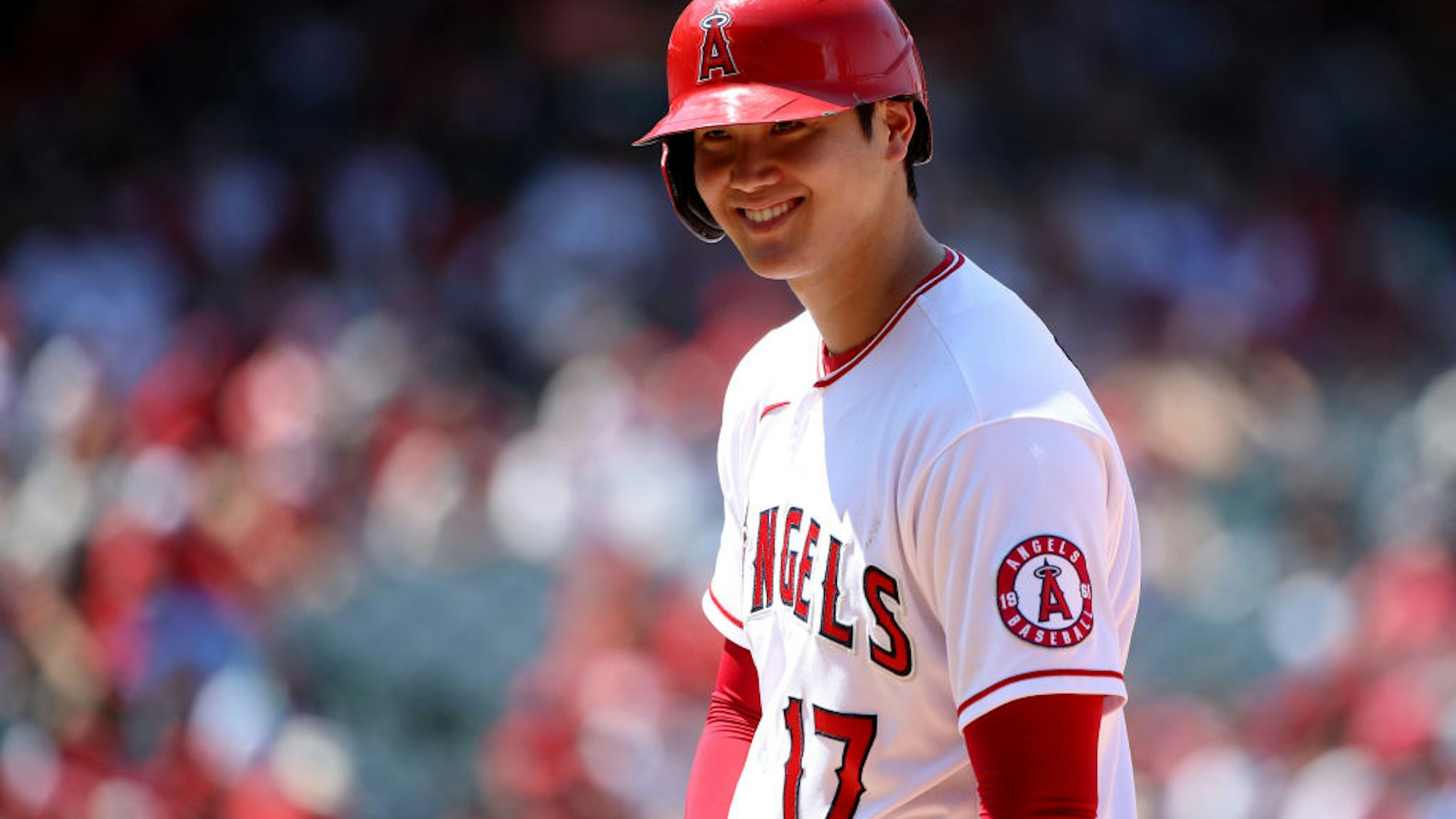 ANAHEIM, CALIFORNIA - JULY 18: Shohei Ohtani #17 of the Los Angeles Angels looks on from first base during the fifth inning against the Seattle Mariners at Angel Stadium of Anaheim on July 18, 2021 in Anaheim, California. (Photo by Katelyn Mulcahy/Getty Images)