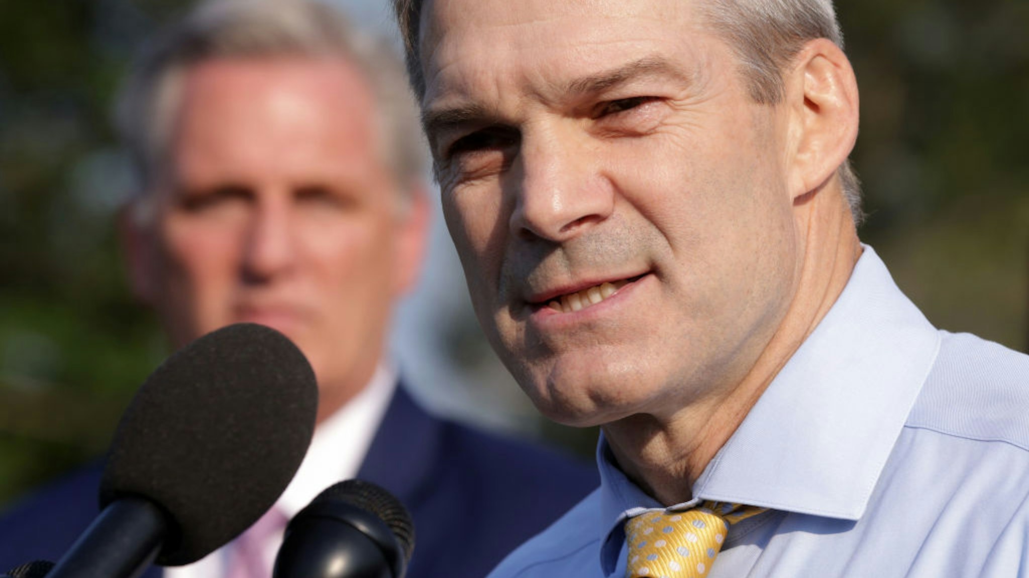 U.S. Jim Jordan (R-OH) (R) speaks as House Minority Leader Rep. Kevin McCarthy (R-CA) listens during a news conference in front of the U.S. Capitol on July 27, 2021 in Washington, DC.