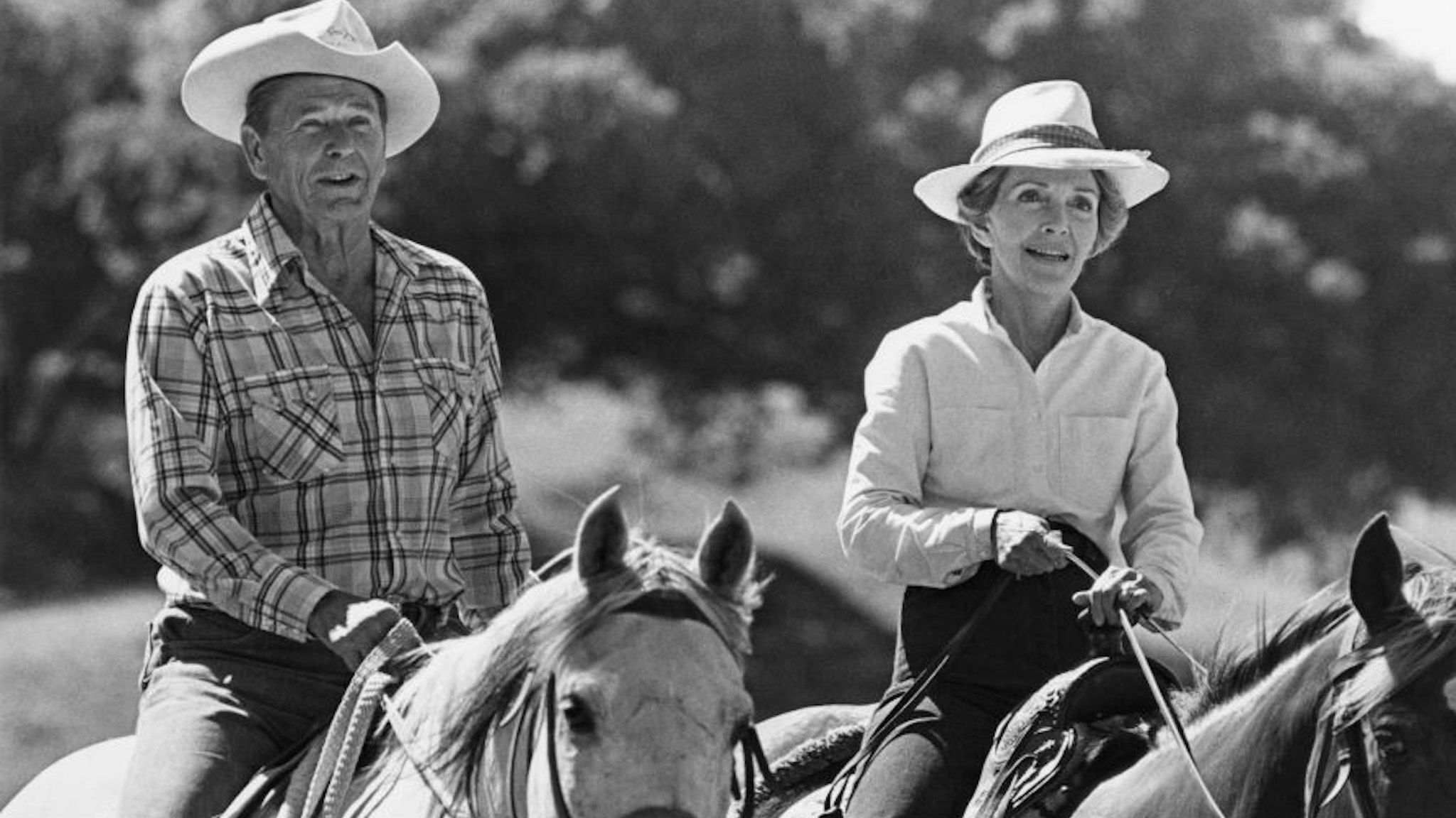 10th January 1981: US President Ronald Reagan and First Lady Nancy Reagan ride horses next to each other. Photograph probably taken at their ranch in Santa Barbara, California. (Photo by Express/Express/Getty Images)