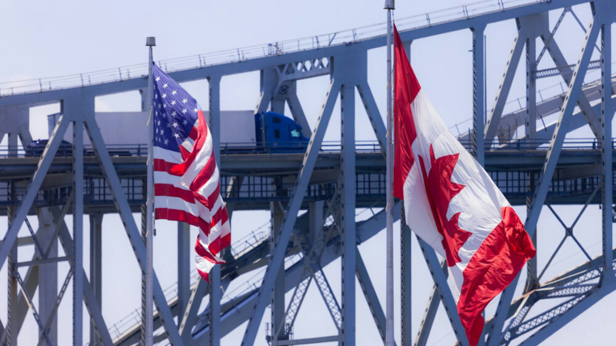 Sarnia, Canada - June 11, 2017. Trucks and cars make their way across the Blue Water Bridge in Sarnia Canada. Opened in 1938 the bridge connects Canada to the United States.