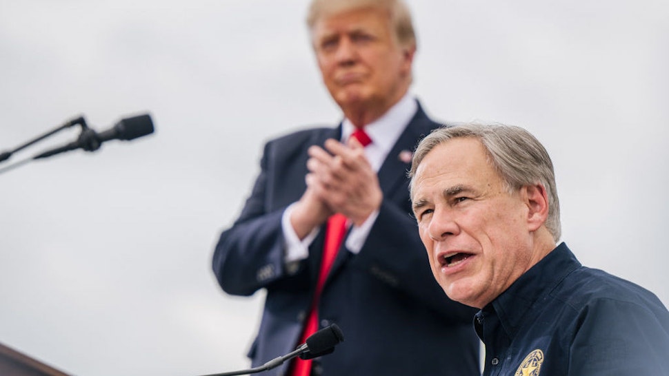 PHARR, TEXAS - JUNE 30: Texas Gov. Greg Abbott speaks alongside former President Donald Trump during a tour to an unfinished section of the border wall on June 30, 2021 in Pharr, Texas. Gov. Abbott has pledged to build a state-funded border wall between Texas and Mexico as a surge of mostly Central American immigrants crossing into the United States has challenged U.S. immigration agencies. So far in 2021, U.S. Border Patrol agents have apprehended more than 900,000 immigrants crossing into the United States on the southern border. (Photo by Brandon Bell/Getty Images)