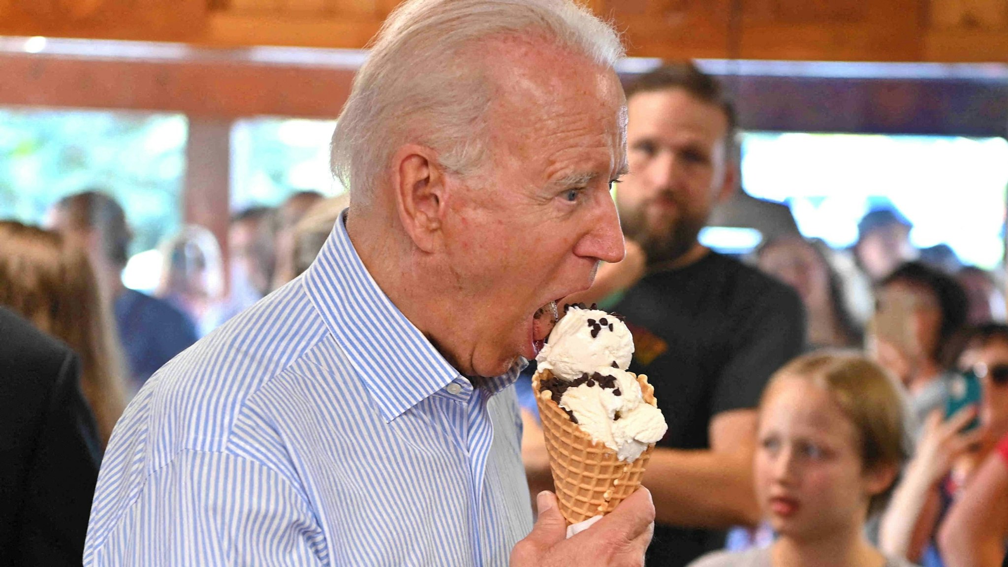 US President Joe Biden eats ice cream at Moomers Homemade Ice Cream in Traverse City, Michigan on July 3, 2021.