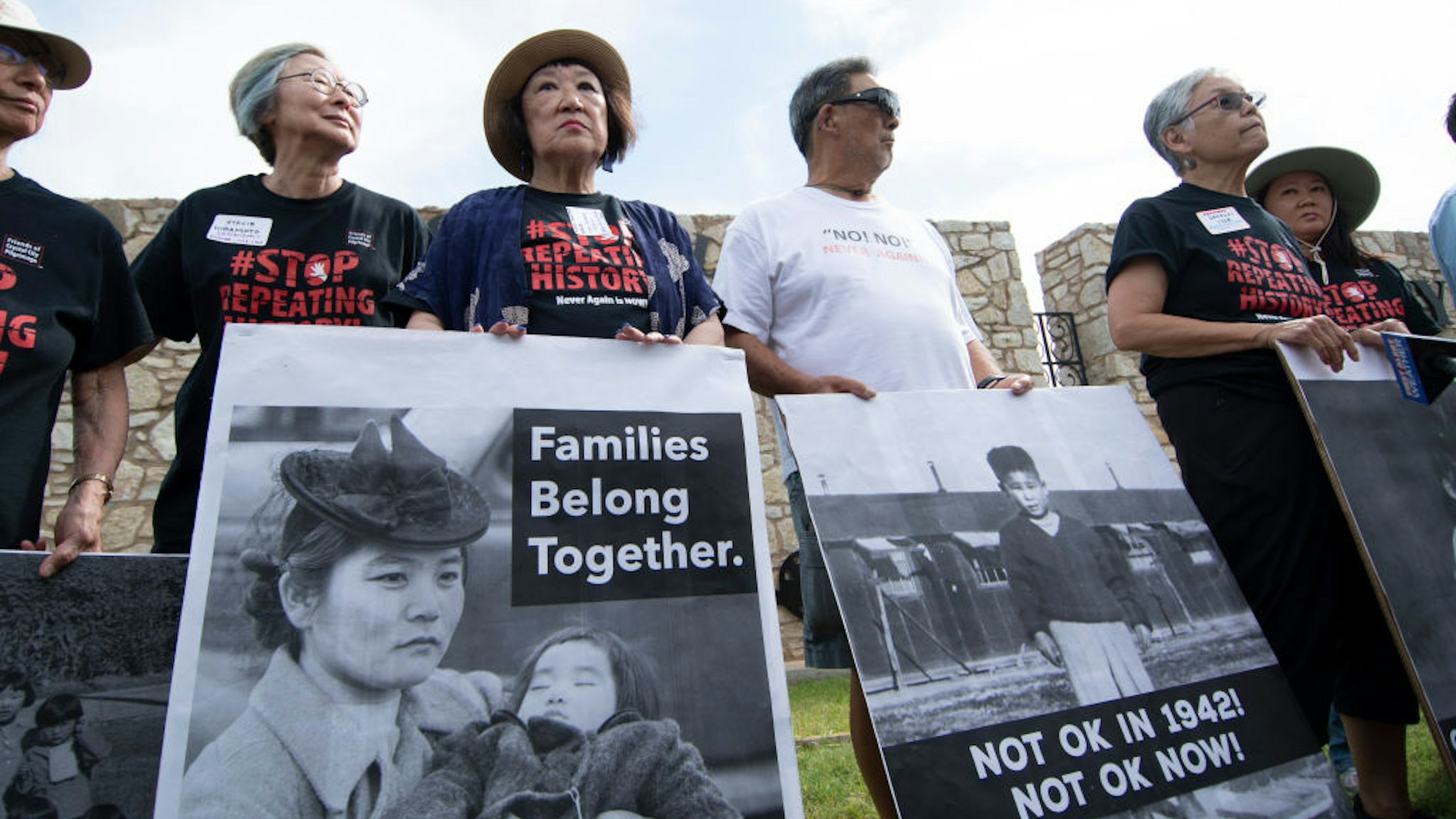 FORT SILL, OK - JUNE 22: Japanese Americans pose with photos of themselves taken while they were in relocation camps in WWII, during a press conference on June 22, 2019 in Lawton, Oklahoma to protest the military base, Fort Sill, being used to house 1,400 migrant children. Fort Still has a history of housing those seeking asylum as well as Japanese Americans were imprisoned during WWII and Native Americans were housed there.