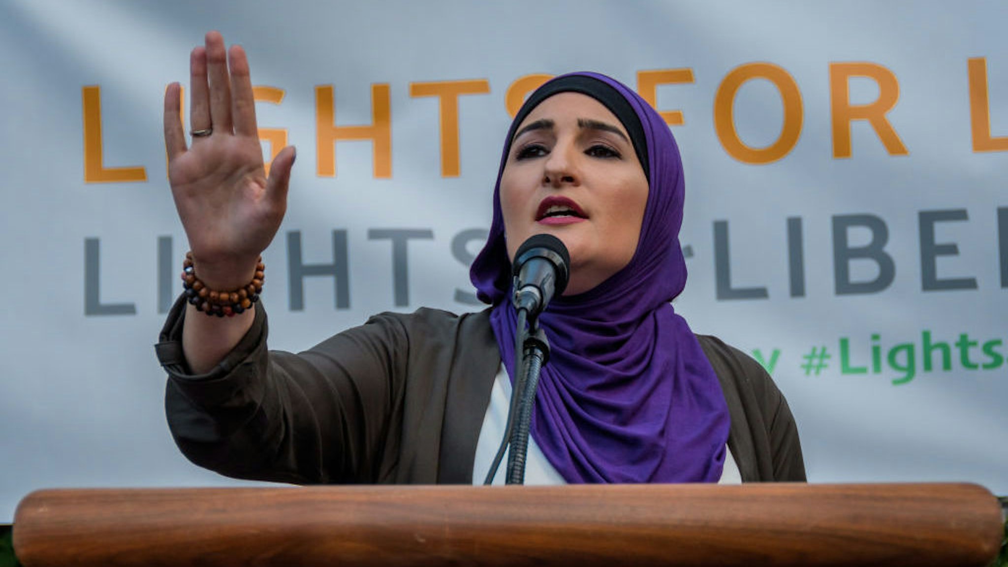 FOLEY SQUARE, NEW YORK, UNITED STATES - 2019/07/12: Activist Linda Sarsour - Thousands of advocates, activists and community members flooded the streets at Foley Square, across from the Immigration and Customs Enforcement (ICE) New York Field Office to join New Sanctuary Coalition and The New York Immigration Coalition at the Lights for Liberty vigil, deemed one of the largest solidarity actions in history with over 750 vigils across 5 continents. A light was lit for all those held in U.S. detention camps and to bring light to the darkness of the Trump administration’s horrific policies. (Photo by Erik McGregor/LightRocket via Getty Images)