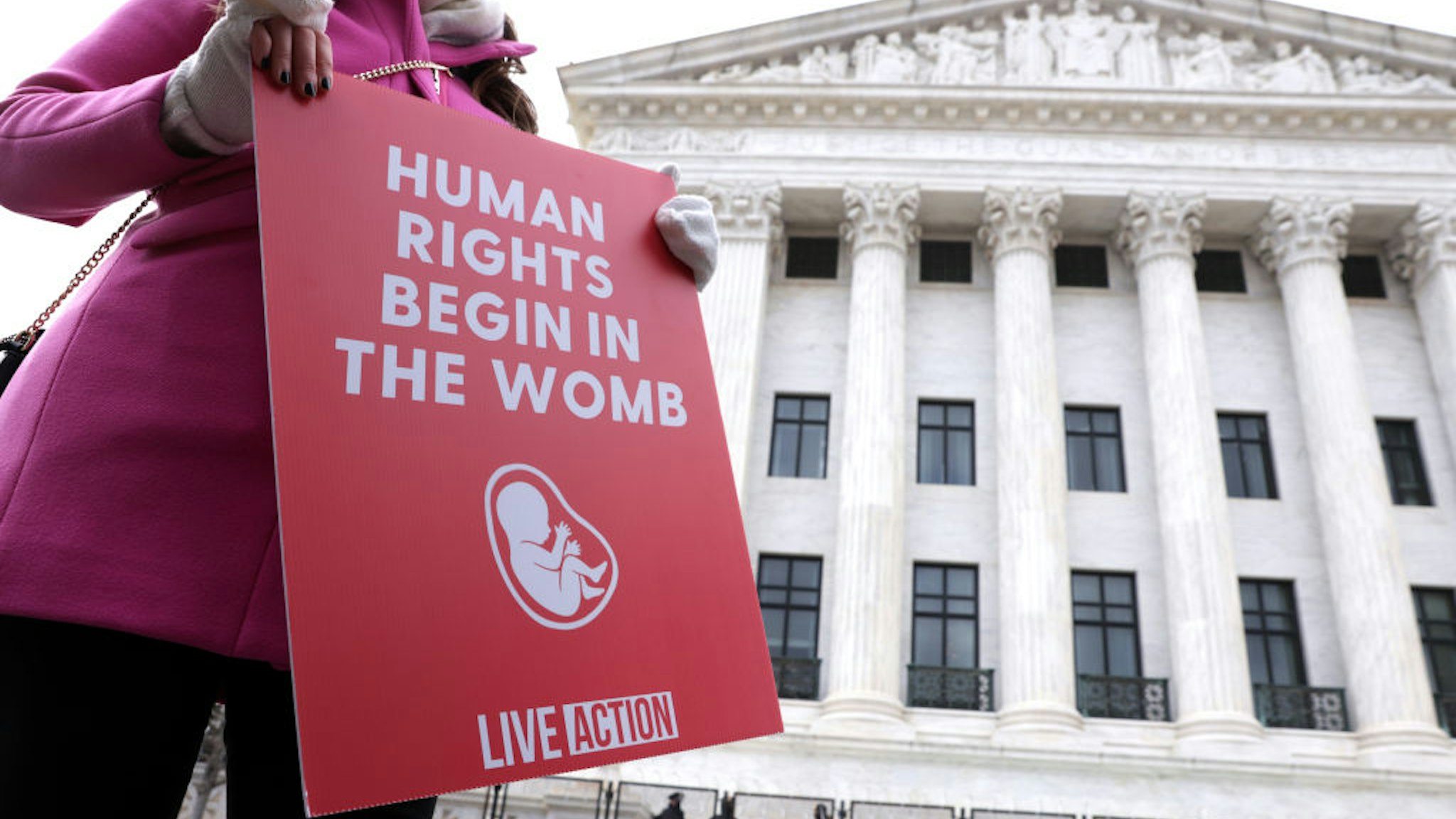 WASHINGTON, DC - JANUARY 29: A pro-life activist holds a sign outside the U.S. Supreme Court during the 48th annual March for Life January 29, 2021 in Washington, DC. Due to the COVID-19 pandemic, a much smaller group of activists participated in the annual march that marked the 1973 Roe v. Wade ruling by the U.S. Supreme Court that had legalized abortion.