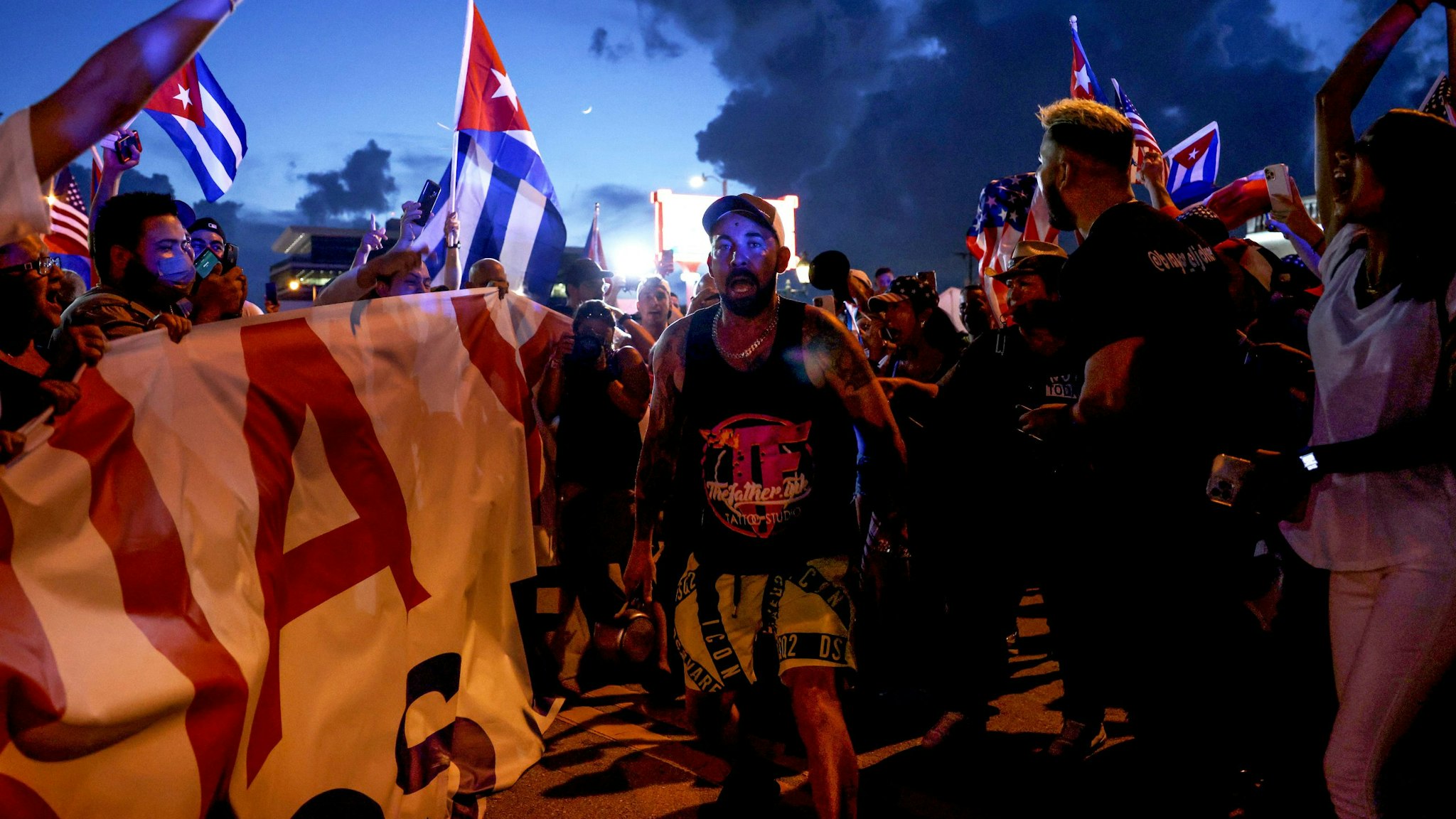 MIAMI, FLORIDA - JULY 11: People rally near Versailles, a Cuban restaurant in the Little Havana neighborhood, in support of the protests in Cuba on July 11, 2021 in Miami, Florida. Thousands took to the streets across Cuba to protest pandemic restrictions, the pace of Covid-19 vaccinations and the Cuban government.
