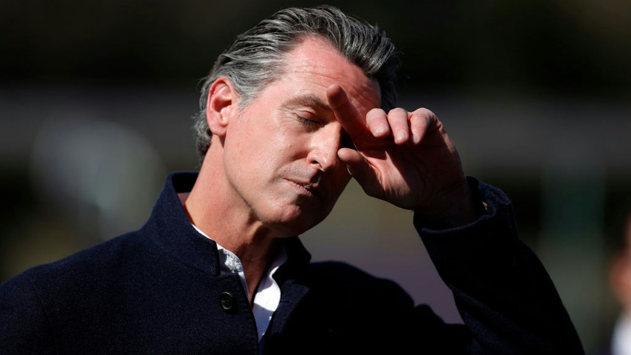 PALO ALTO, CALIFORNIA - MARCH 02: California Gov. Gavin Newsom pauses during a news conference after touring Barron Park Elementary School on March 02, 2021 in Palo Alto, California.