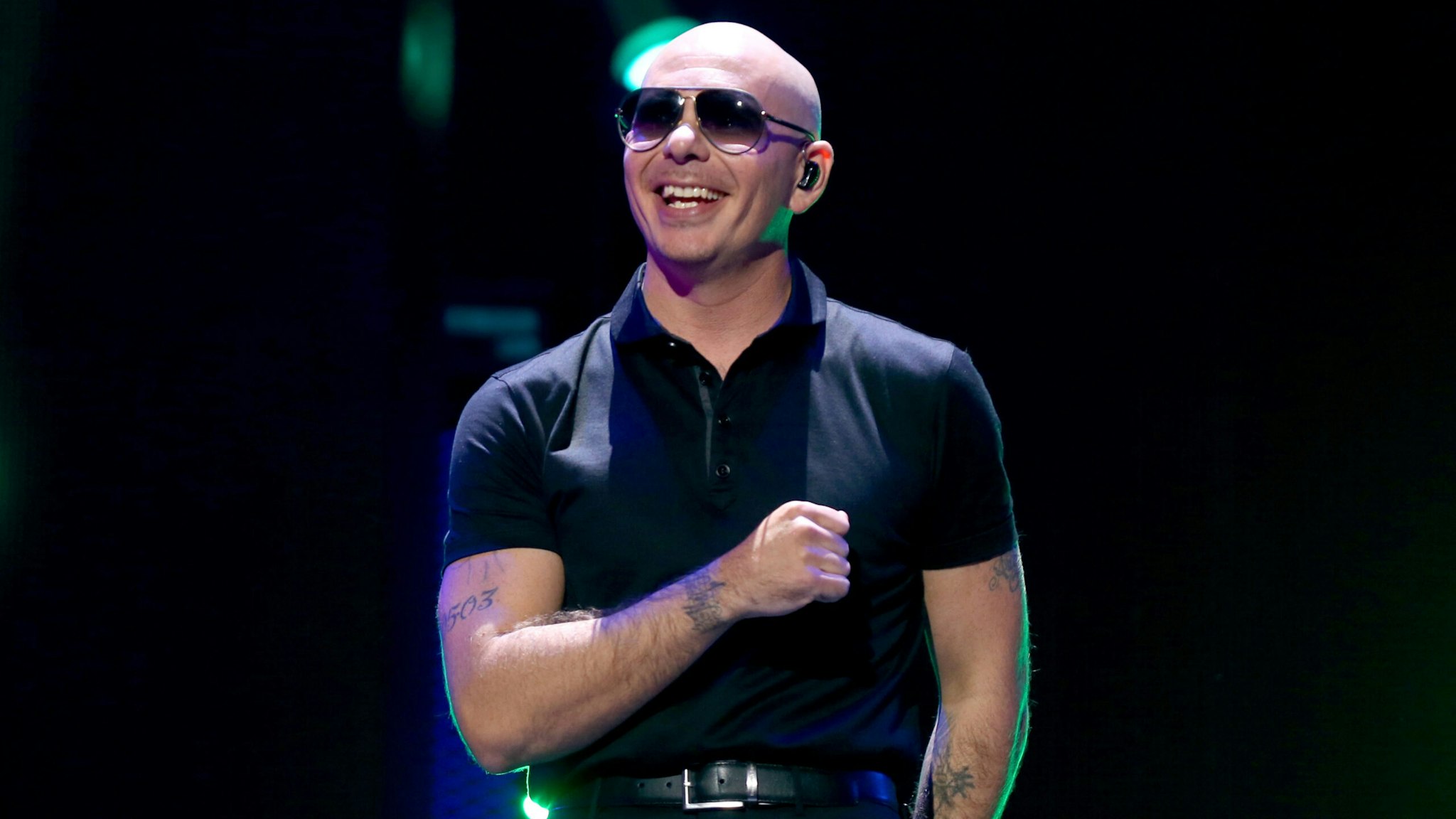 LAS VEGAS, NV - SEPTEMBER 24: Recording artist Pitbull performs onstage at the 2016 iHeartRadio Music Festival at T-Mobile Arena on September 24, 2016 in Las Vegas, Nevada.