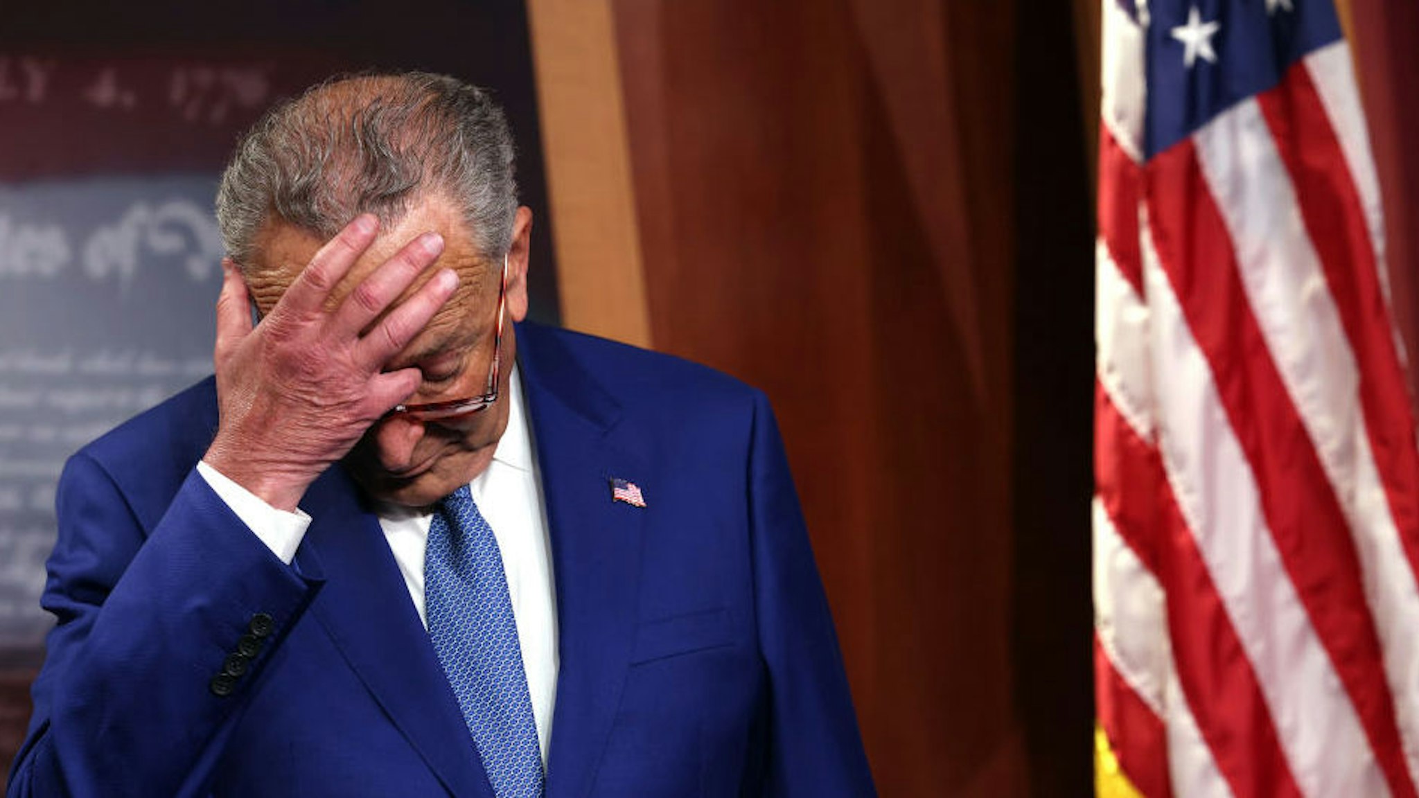WASHINGTON, DC - JULY 14: U.S. Senate Majority Leader Charles Schumer (D-NY) scratches his head as he attends a press conference on introducing legislation to end federal cannabis prohibition at the U.S. Capitol on July 14, 2021 in Washington, DC. The Senate Democratic leader is introducing The Cannabis Administration And Opportunity Act, which will remove marijuana from the list of controlled substances and begin regulating and taxing it at the federal level.