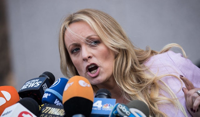 NEW YORK, NY - APRIL 16: Adult film actress Stormy Daniels (Stephanie Clifford) speaks to reporters as she exits the United States District Court Southern District of New York for a hearing related to Michael Cohen, President Trump's longtime personal attorney and confidante, April 16, 2018 in New York City. Cohen and lawyers representing President Trump are asking the court to block Justice Department officials from reading documents and materials related to Cohen's relationship with President Trump that they believe should be protected by attorney-client privilege. Officials with the FBI, armed with a search warrant, raided Cohen's office and two private residences last week. (Photo by Drew Angerer/Getty Images)