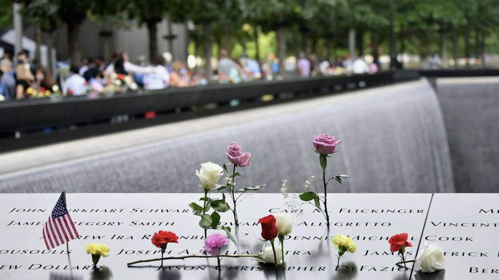 US-ATTACKS-9/11-ANNIVERSARY Mourners gather at the 9/11 Memorial & Museum in New York on September 11, 2020, as the US commemorates the 19th anniversary of the 9/11 attacks. (Photo by Angela Weiss / AFP) (Photo by ANGELA WEISS/AFP via Getty Images) ANGELA WEISS / Contributor via Getty Images