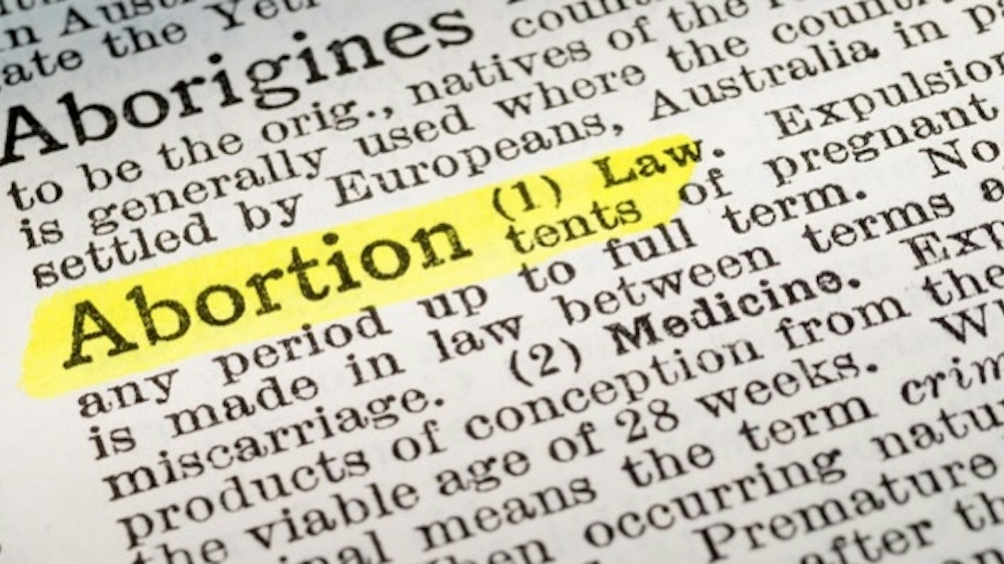 Abortion - dictionary definition highlighted - stock photo The term Abortion - dictionary definition highlighted with yellow marker stockcam via Getty Images
