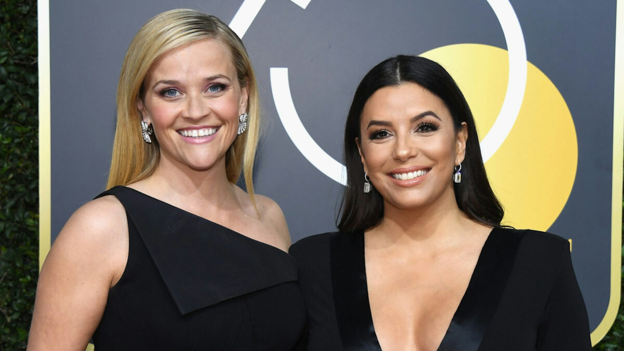 Actors Reese Witherspoon (L) and Eva Longoria arrive to the 75th Annual Golden Globe Awards held at the Beverly Hilton Hotel on January 7, 2018.