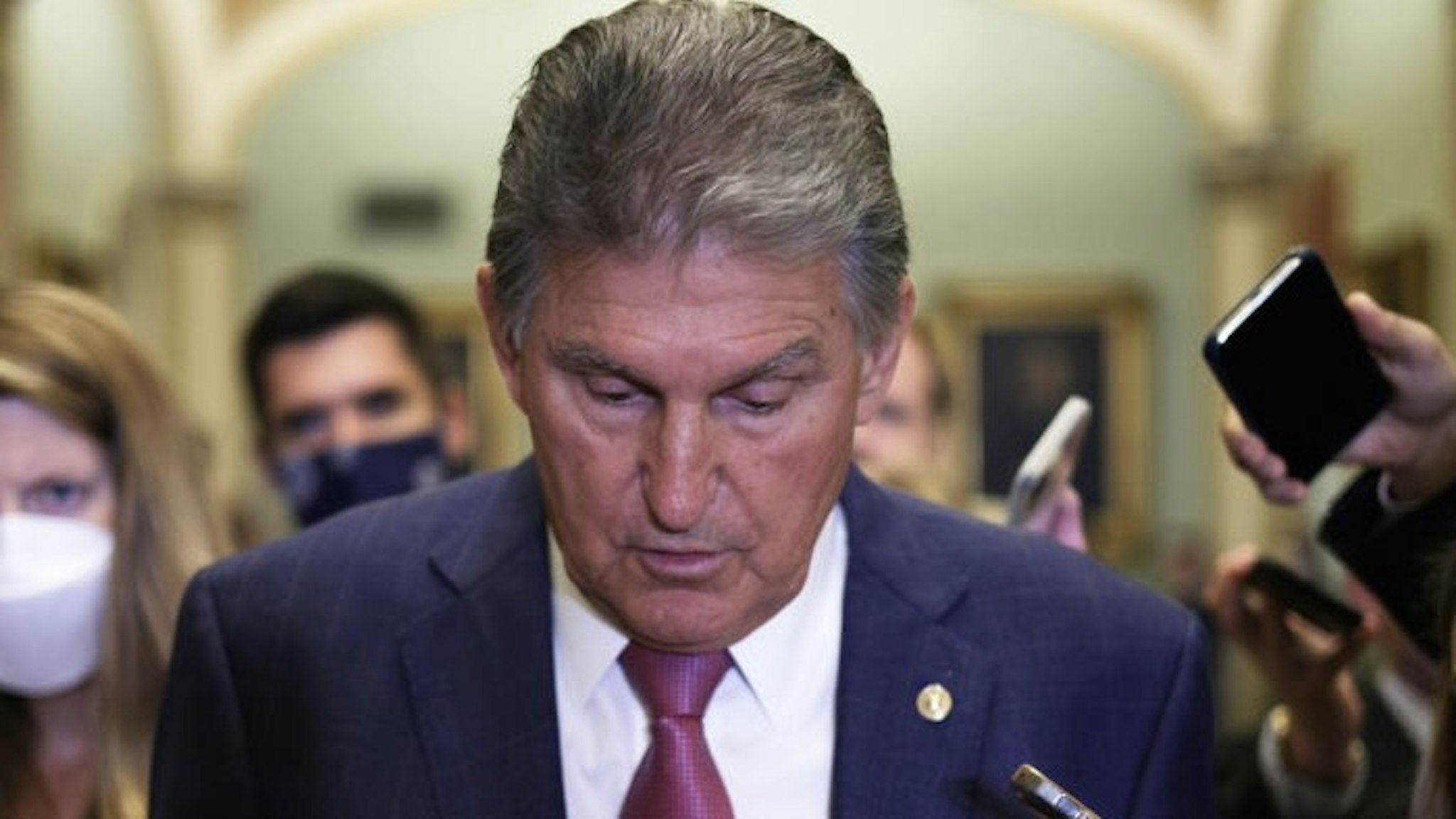 Senators Meet For Weekly Policy Luncheons On Capitol Hill WASHINGTON, DC - JULY 27: U.S. Sen. Joe Manchin (D-WV) (C) speaks to members of the press after a weekly Senate Democratic Policy Luncheon at the U.S. Capitol on July 27, 2021 in Washington, DC. Senate Democrats held a weekly policy luncheon to discuss the Democratic agenda. (Photo by Alex Wong/Getty Images) Alex Wong / Staff via Getty Images