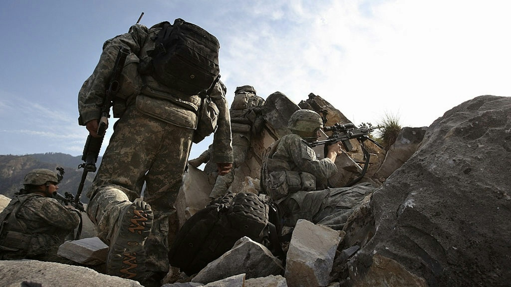 U.S. Forces Battle Taliban In Kunar Province KORENGAL VALLEY, AFGHANISTAN - OCTOBER 28: U.S. Army soldiers take firing positions after climbing a mountain October 28, 2008 in the Korengal Valley in eastern Afghanistan. American forces from 2nd Platoon Viper Company of the 1-26 Infantry occupied a strategic mountaintop, and were attacked by Taliban insurgents. No Americans were injured in the ensuing firefight and Taliban casualties were unknown. The Korengal Valley in Kunar Province is the site of some of the heaviest fighting of the Afghan war. (Photo by John Moore/Staff/Getty Images)