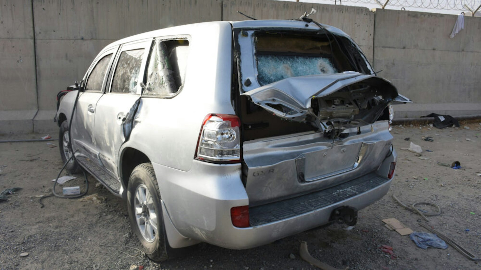 KABUL, AFGHANISTAN - AUGUST 20: Destroyed vehicles are seen at the entrance of the airport in Kabul, Afghanistan on August 20, 2021. People who wanted to leave the country had to leave their vehicles at the international airport checkpoint. Vehicles damaged by those who could not enter the airport with the hope of evacuation turned into a car junkyard.