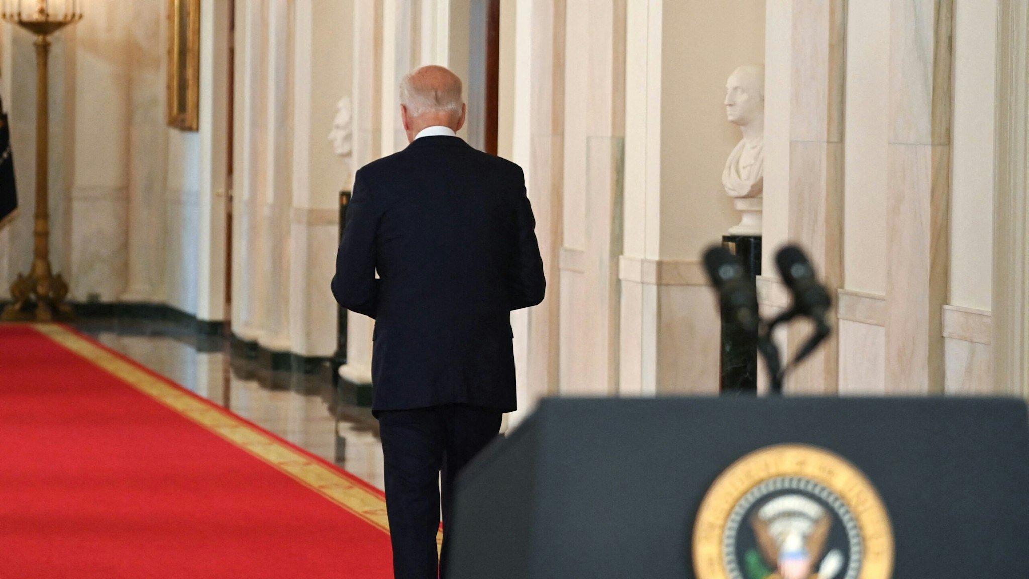 US President Joe Biden walks from the podium after speaking on ending the war in Afghanistan in the State Dining Room at the White House in Washington, DC, on August 31, 2021. - US President Joe Biden is addressing the nation on the US exit from Afghanistan after a failed 20 year war that he'd vowed to end but whose chaotic last days are now overshadowing his presidency.