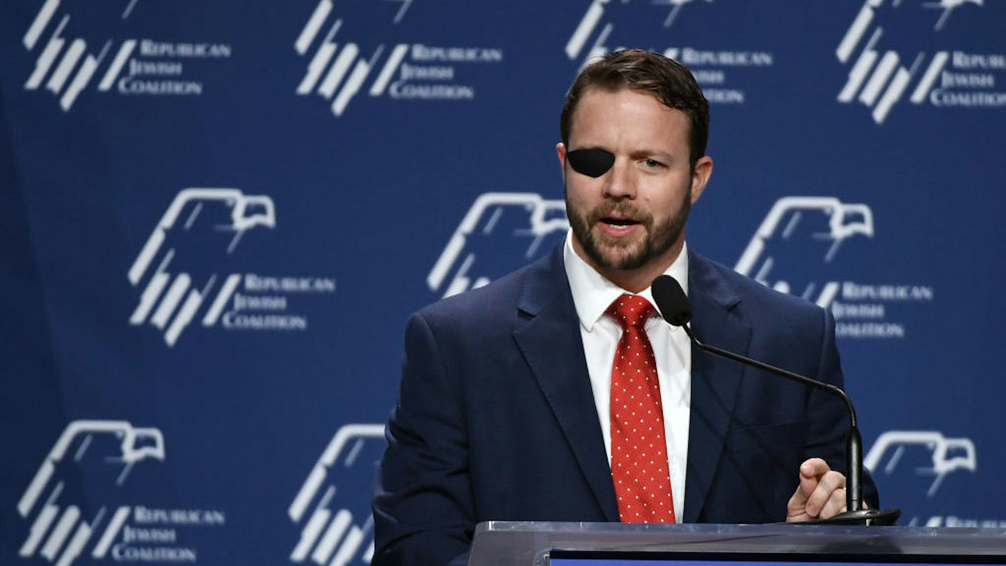 LAS VEGAS, NEVADA - APRIL 06: U.S. Rep. Dan Crenshaw (R-TX) speaks at the Republican Jewish Coalition's annual leadership meeting at The Venetian Las Vegas after appearances by U.S. President Donald Trump and Vice President Mike Pence on April 6, 2019 in Las Vegas, Nevada. Trump has cited his moving of the U.S. embassy in Israel to Jerusalem and his decision to pull the U.S. out of the Iran nuclear deal as reasons for Jewish voters to leave the Democratic party and support him and the GOP instead. (Photo by Ethan Miller/Getty Images)