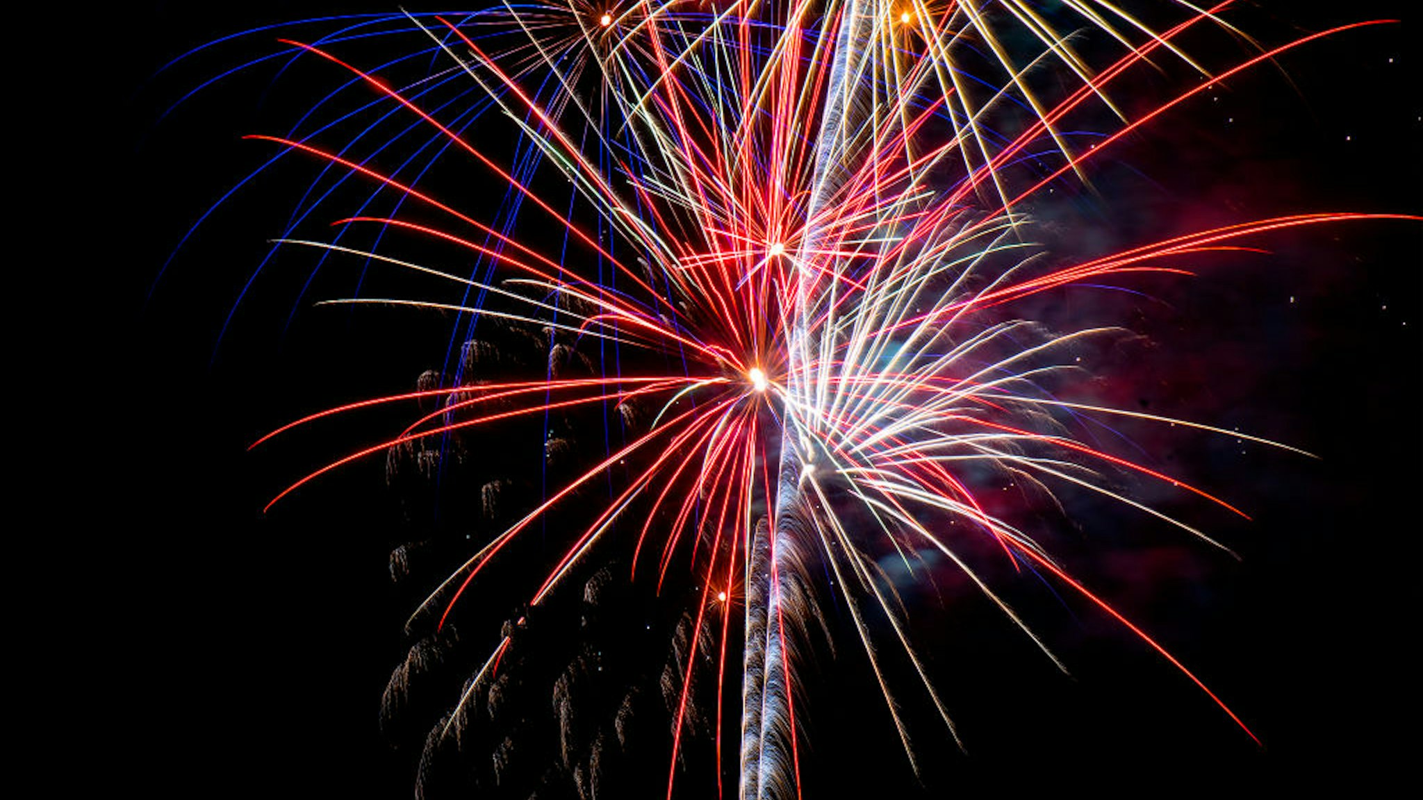 MURRIETA, CA - JULY 02: God Bless America plays through the radio as red, white and blue fireworks light up the sky during Murrietas Independence Day/Birthday Bash at Los Alamos Hills Sports Park on Thursday, July 1, 2021. (Photo by Cindy Yamanaka/MediaNews Group/The Riverside Press-Enterprise via Getty Images)
