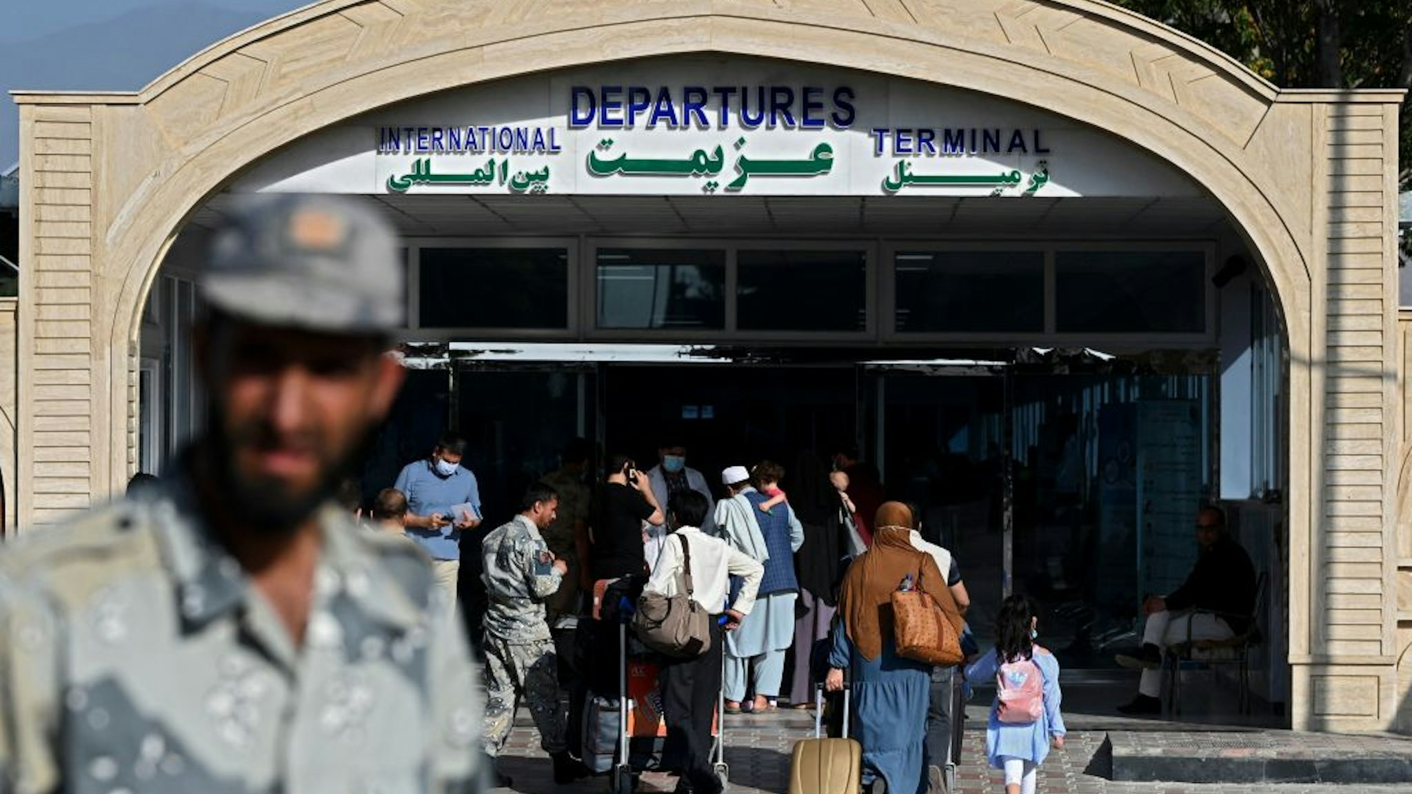 Passengers enter the departures terminal of the Hamid Karzai International Airport in Kabul on July 17, 2021. (Photo by SAJJAD HUSSAIN / AFP) (Photo by SAJJAD HUSSAIN/AFP via Getty Images)