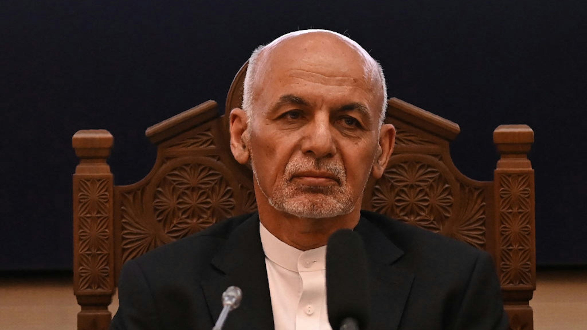 Afghanistan's President Ashraf Ghani looks on while attending a Joint Coordination and Monitoring Board meeting (JCMB) at the Afghan presidential palace in Kabul on July 28, 2021. (Photo by SAJJAD HUSSAIN / AFP) (Photo by SAJJAD HUSSAIN/AFP via Getty Images)