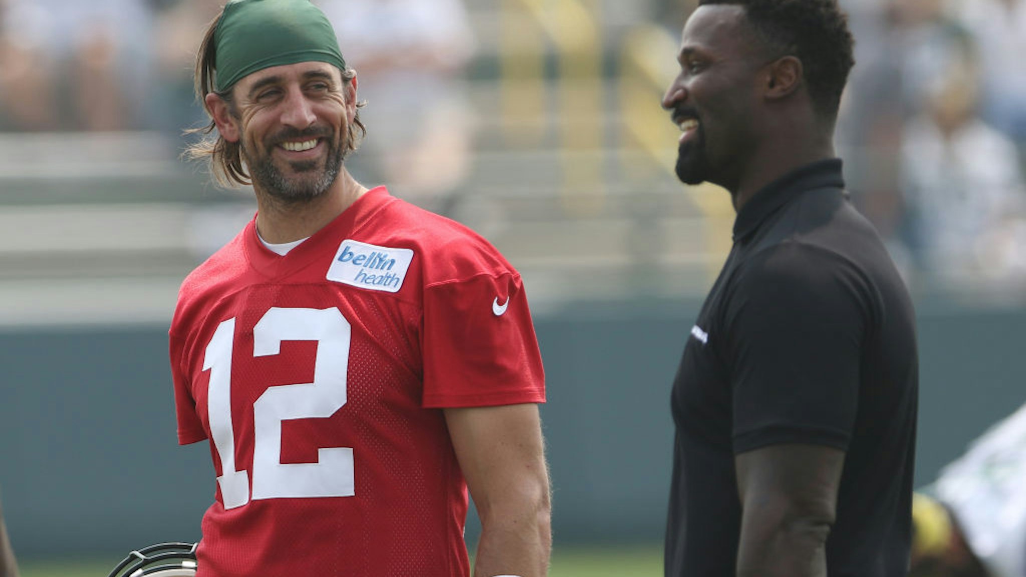 ASHWAUBENON, WI - JULY 31: Green Bay Packers quarterback Aaron Rodgers (12) talks with NFL Network host James Jones during 2021 Training Camp at Ray Nitschke Field on July 31, 2021 in Ashwaubenon, WI. (Photo by Larry Radloff/Icon Sportswire via Getty Images)