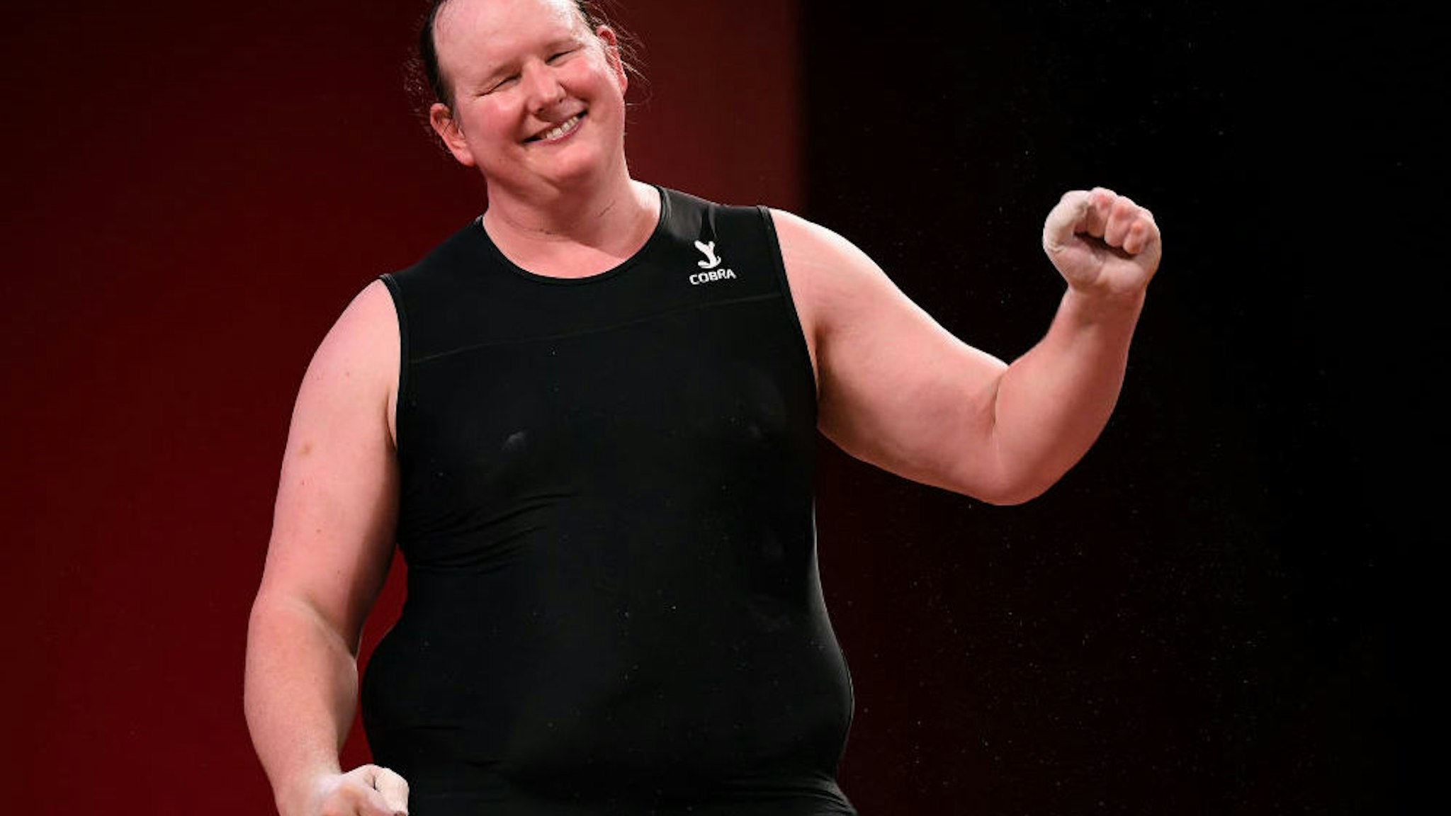 New Zealands Laurel Hubbard, the first transgender Olympian, smiles to the small crowd after failing to advance in the womens 87kg weightlifting final at the 2020 Tokyo Olympics.