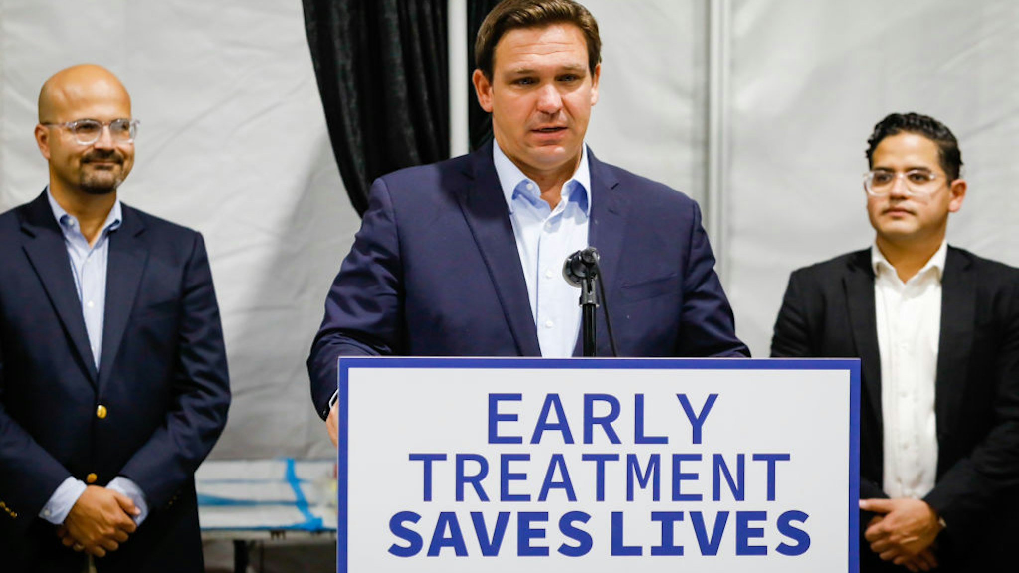 Ron DeSantis, governor of Florida, center, speaks during a news conference at a Regeneron monoclonal antibody clinic in Pembroke Pines, Florida, U.S., on Wednesday, Aug. 18, 2021.
