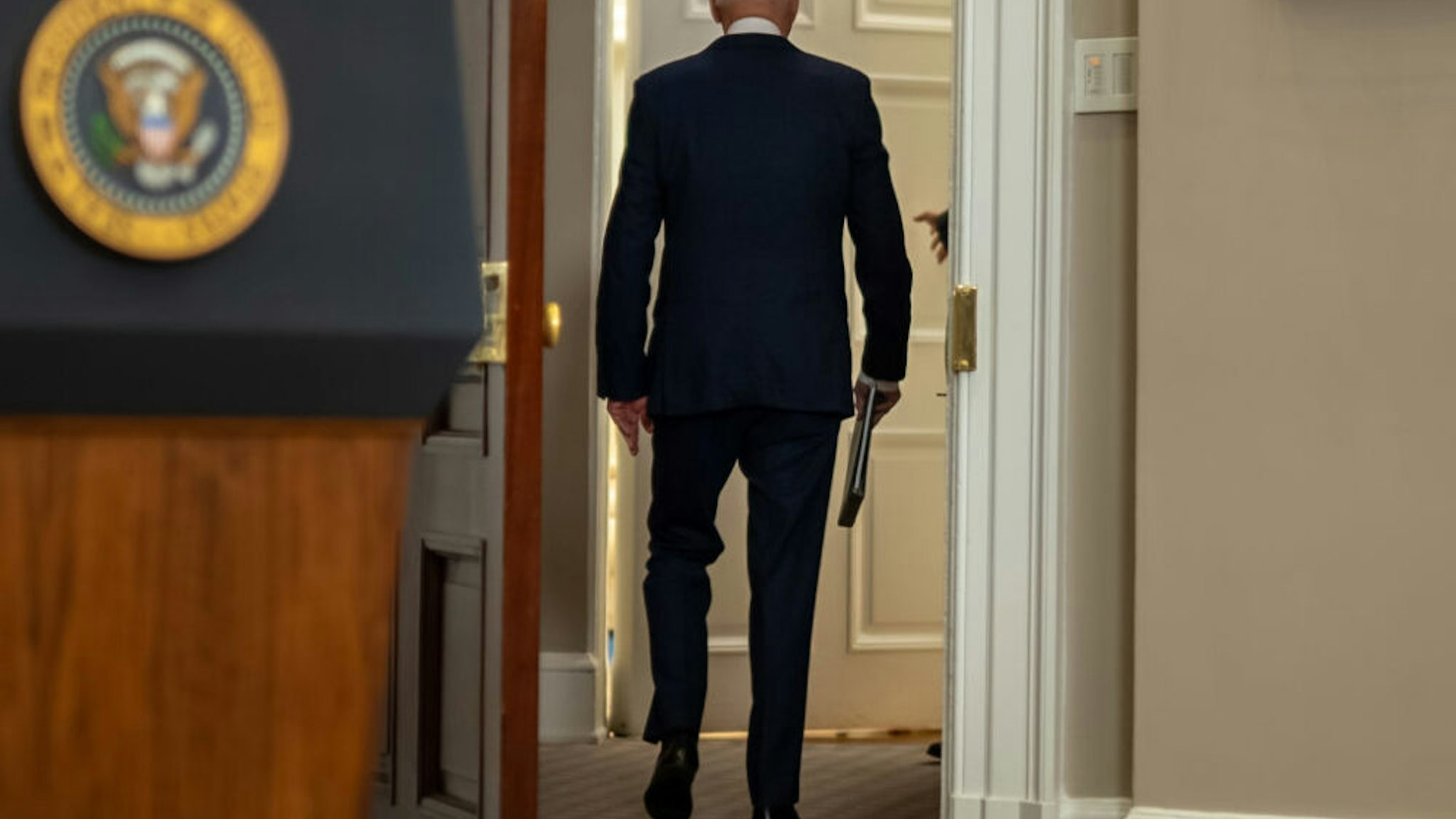 U.S. President Joe Biden departs after speaking in the Roosevelt Room of the White House in Washington, D.C., U.S., on Sunday, Aug. 22, 2021. Biden said the U.S. has expanded its evacuation efforts beyond the perimeter of the Kabul airport, warned of possible terror attacks and acknowledged that he may be forced to push back his deadline for leaving Afghanistan.