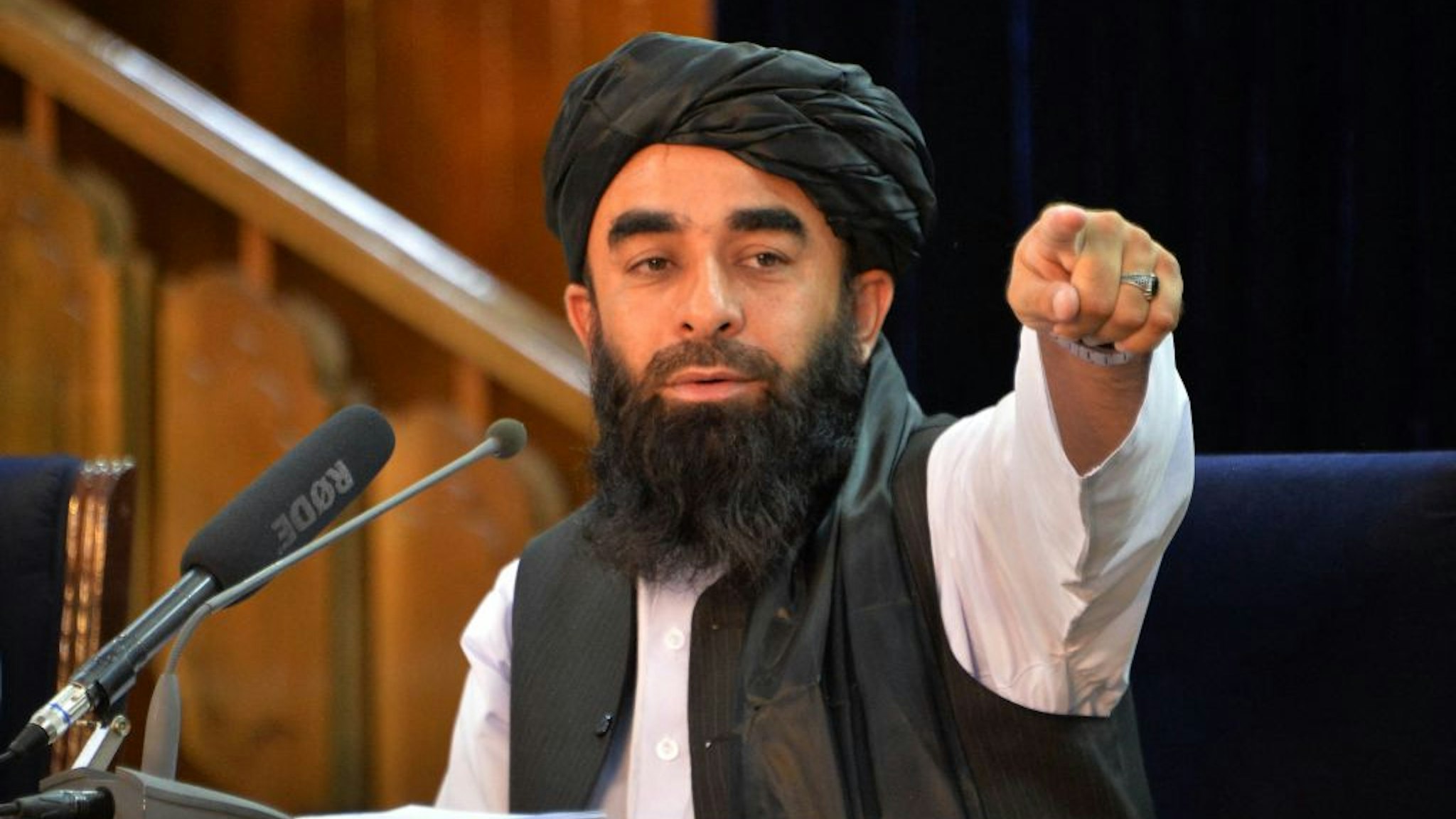 TOPSHOT - Taliban spokesperson Zabihullah Mujahid gestures during a press conference in Kabul on August 24, 2021 after the Taliban stunning takeover of Afghanistan. (Photo by Hoshang Hashimi / AFP) (Photo by HOSHANG HASHIMI/AFP via Getty Images)