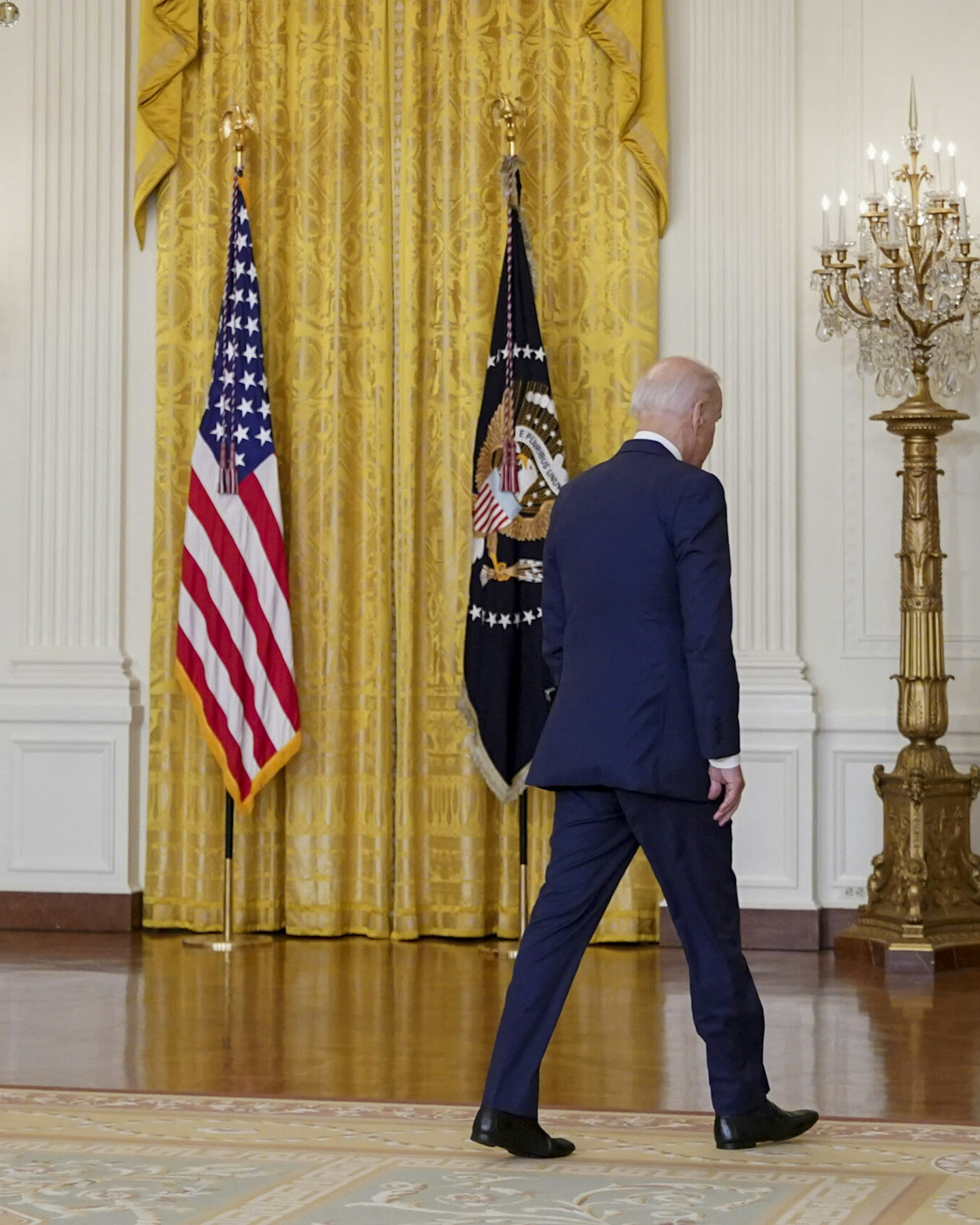 U.S. President Joe Biden exits after speaking in the East Room of the White House in Washington, D.C., U.S., on Thursday, Aug. 26, 2021. Biden vowed to continue evacuations from Afghanistan after explosions in Kabul killed 12 U.S. service members, and said the U.S. will retaliate against those responsible for the bombings. Photographer: Al Drago/Bloomberg via Getty Images