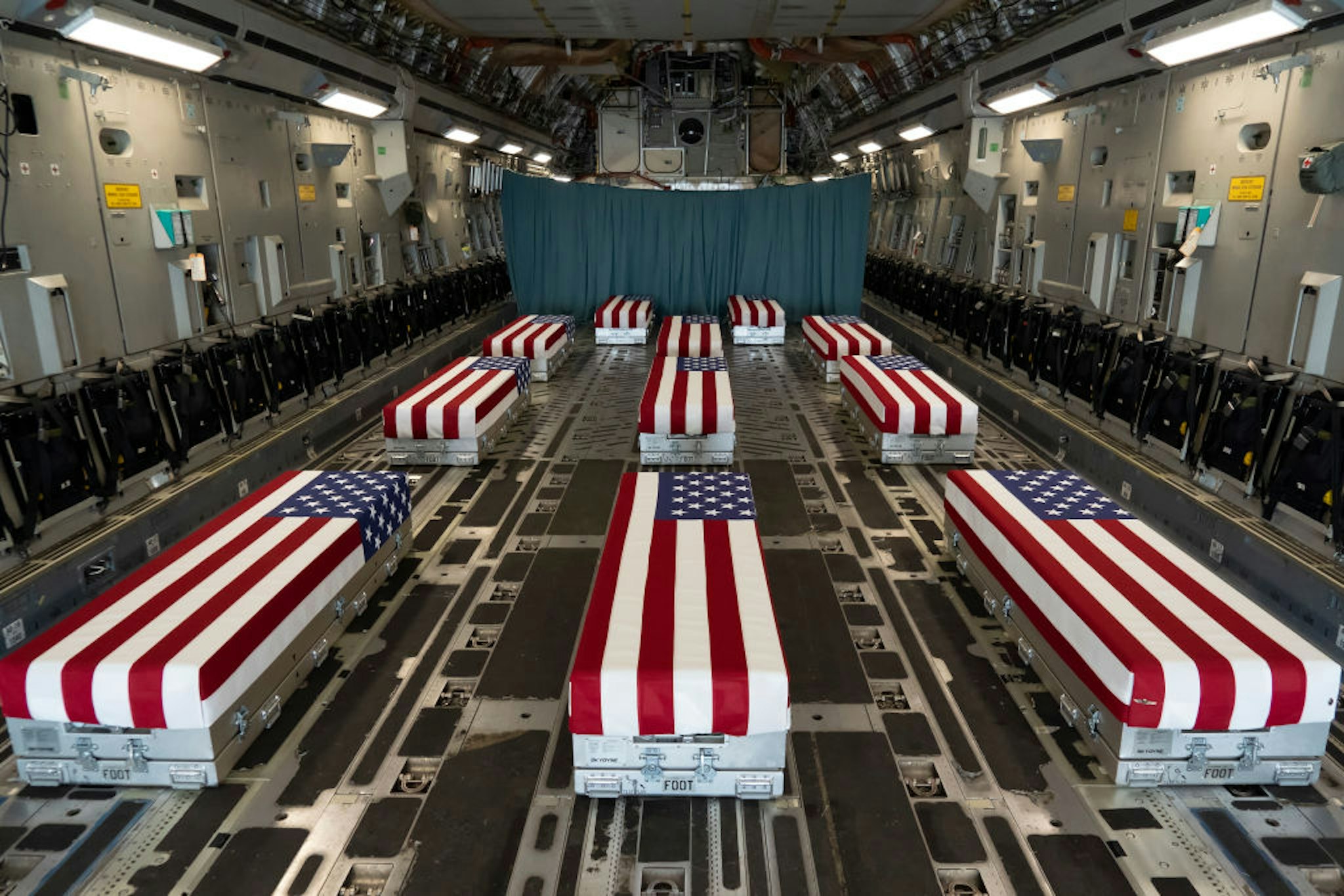 In this handout photo provided by the U.S. Air Force, flag-draped transfer cases line the inside of a C-17 Globemaster II Aug. 29, 2021, prior to a dignified transfer at Dover Air Force Base, Delaware.