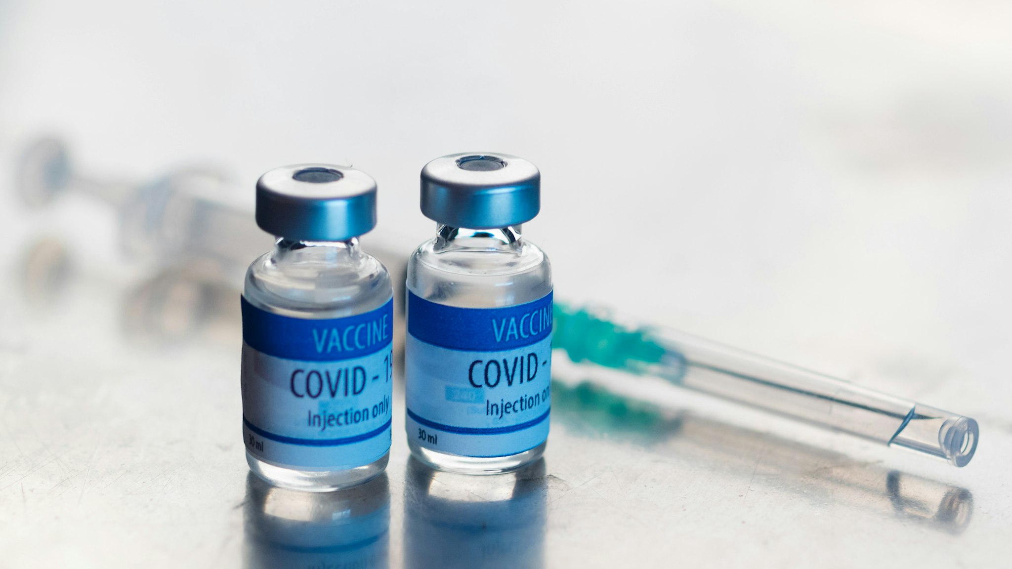 Ready-to-inject vials of Covid-19 vaccine - stock photo
