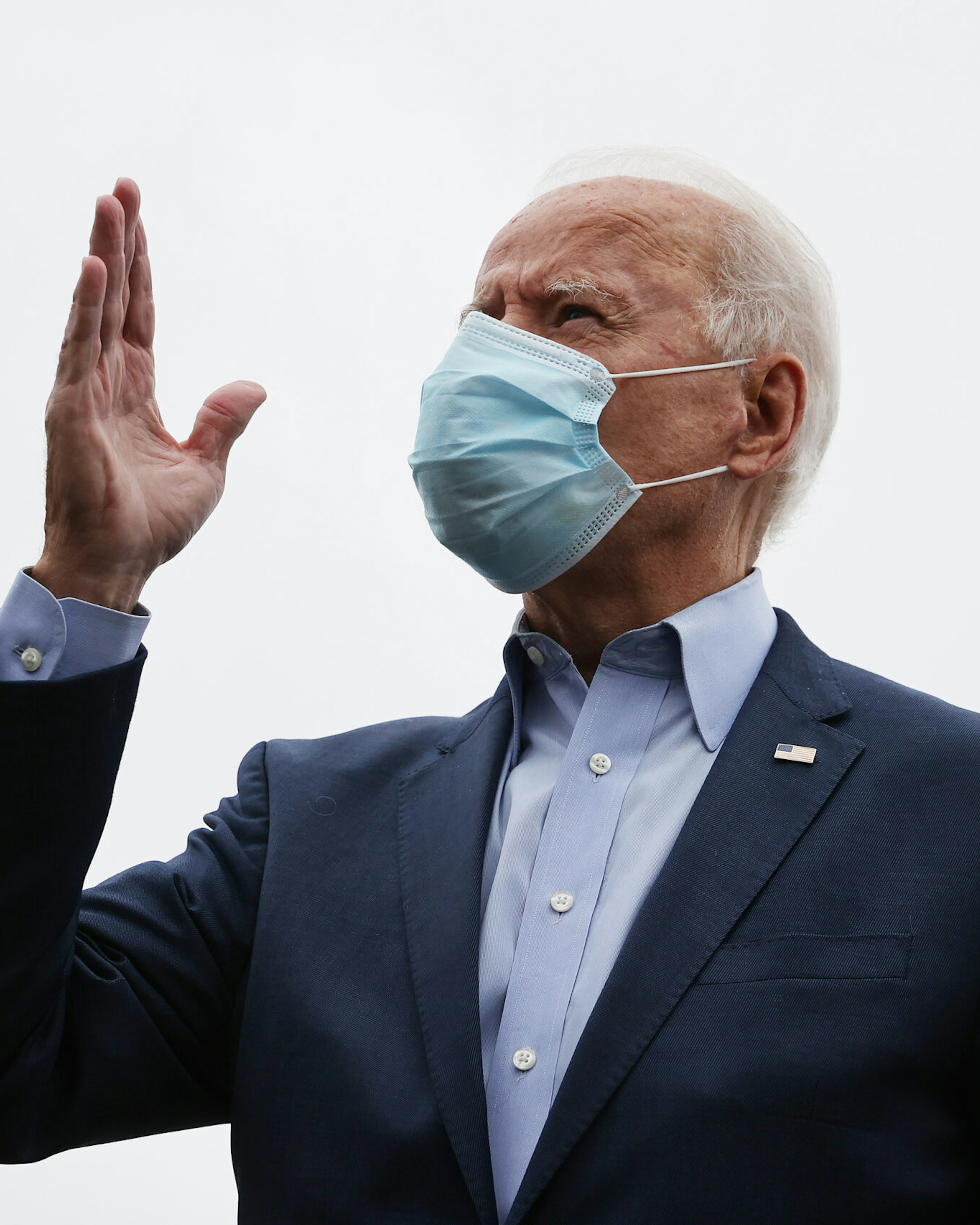 NEW CASTLE, DELAWARE - OCTOBER 12: Wearing a face mask to reduce the risk posed by the coronavirus, Democratic presidential nominee Joe Biden talks to reporters before boarding a flight to Ohio at New Castle County Airport October 12, 2020 in New Castle, Delaware. With 21 days until the election, Biden will campaign in Toledo and Cincinnati. (Photo by Chip Somodevilla/Getty Images)