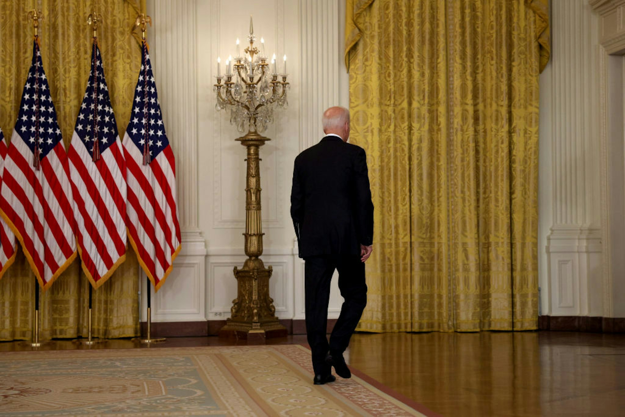 U.S. President Joe Biden walks away without taking questions after delivering remarks on the worsening crisis in Afghanistan from the East Room of the White House August 16, 2021 in Washington, DC.