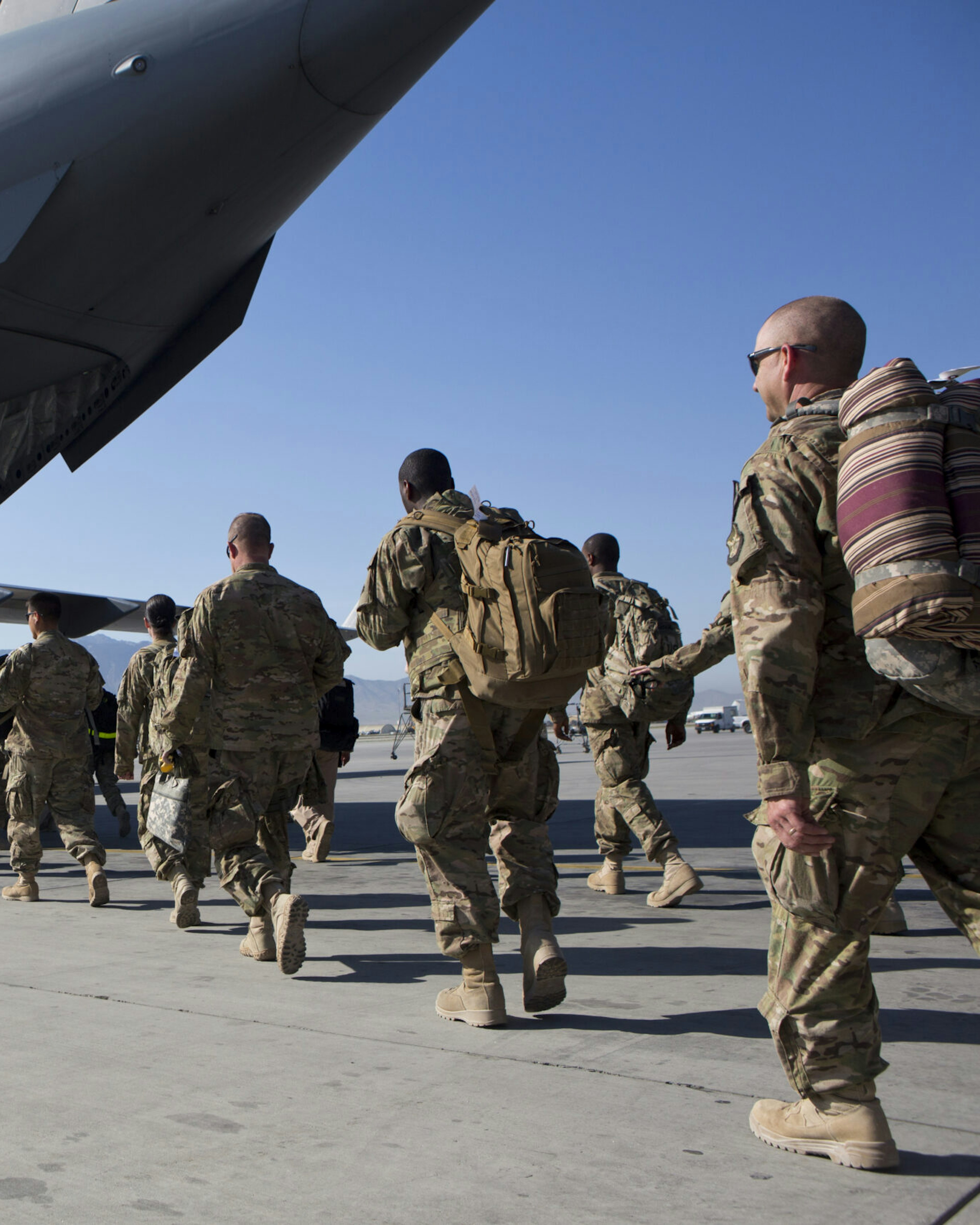 BAGRAM AIR BASE, AFGHANISTAN - MAY 11: U.S. Army soldiers walk to their C-17 cargo plane for departure May 11, 2013 at Bagram Air Base, Afghanistan. U.S. soldiers and marines are part of the NATO troop withdrawal from Afghanistan, to be completed by the end of 2014. (Photo by Robert Nickelsberg/Getty Images)