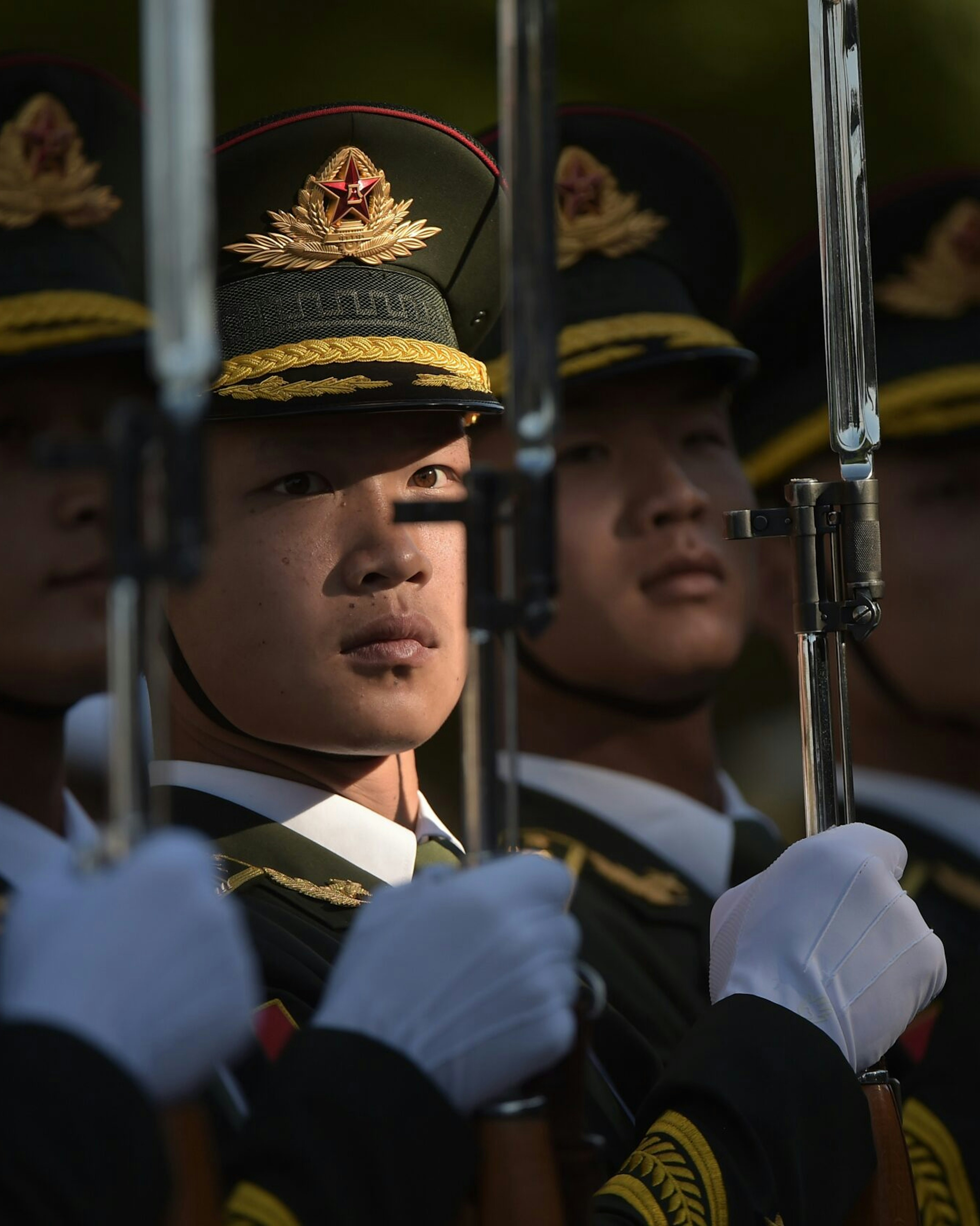 TOPSHOT - Members of a Chinese military honour guard prepare before a welcome ceremony for Afghanistan's Chief Executive Officer Abdullah Abdullah in Beijing on May 16, 2016. - Abdullah was welcomed by Chinese Premier Li Keqiang. (Photo by NICOLAS ASFOURI / AFP) (Photo by NICOLAS ASFOURI/AFP via Getty Images)