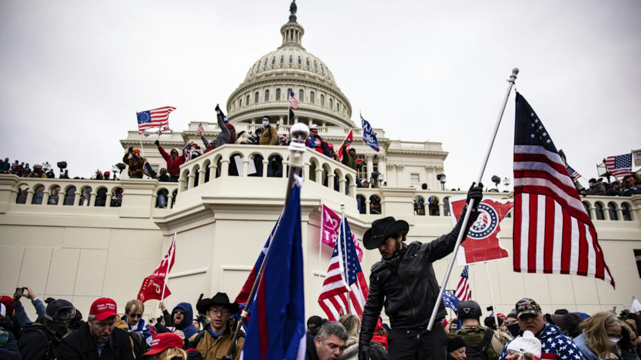 WASHINGTON, DC - JANUARY 06: Pro-Trump supporters storm the U.S. Capitol following a rally with President Donald Trump on January 6, 2021 in Washington, DC. Trump supporters gathered in the nation's capital today to protest the ratification of President-elect Joe Biden's Electoral College victory over President Trump in the 2020 election.