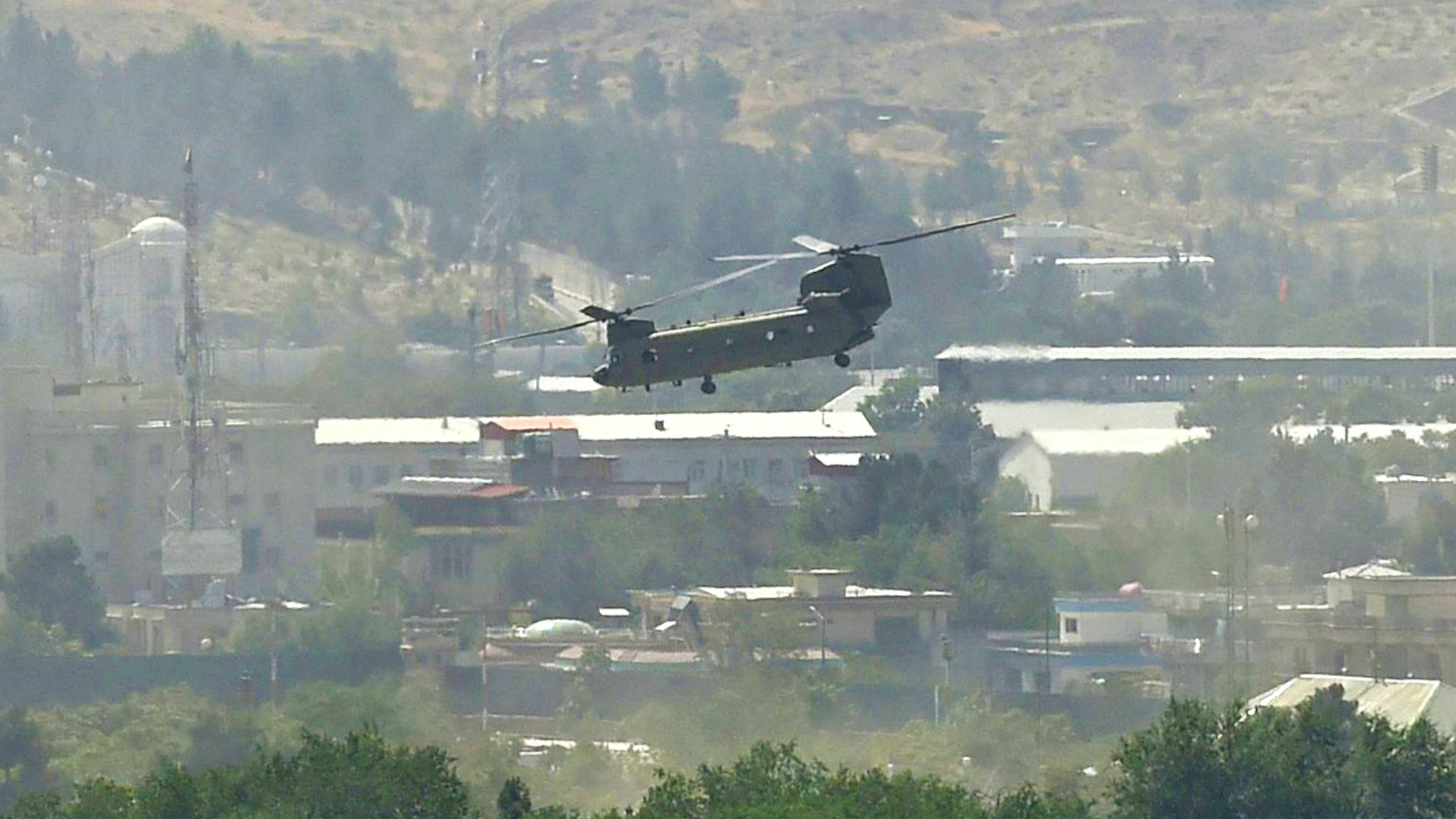 A US military helicopter is pictured flying above the US embassy in Kabul on August 15, 2021.