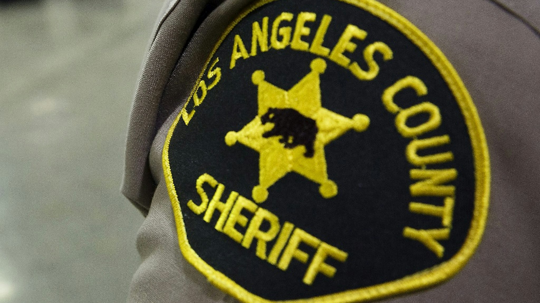 A Los Angeles County Sheriffs Department patch is seen on the shoulder of a deputy at the Los Angeles County Sheriffs Department Twin Towers Correctional Facility in Los Angeles, California, U.S., on Tuesday, Sept. 23, 2014.